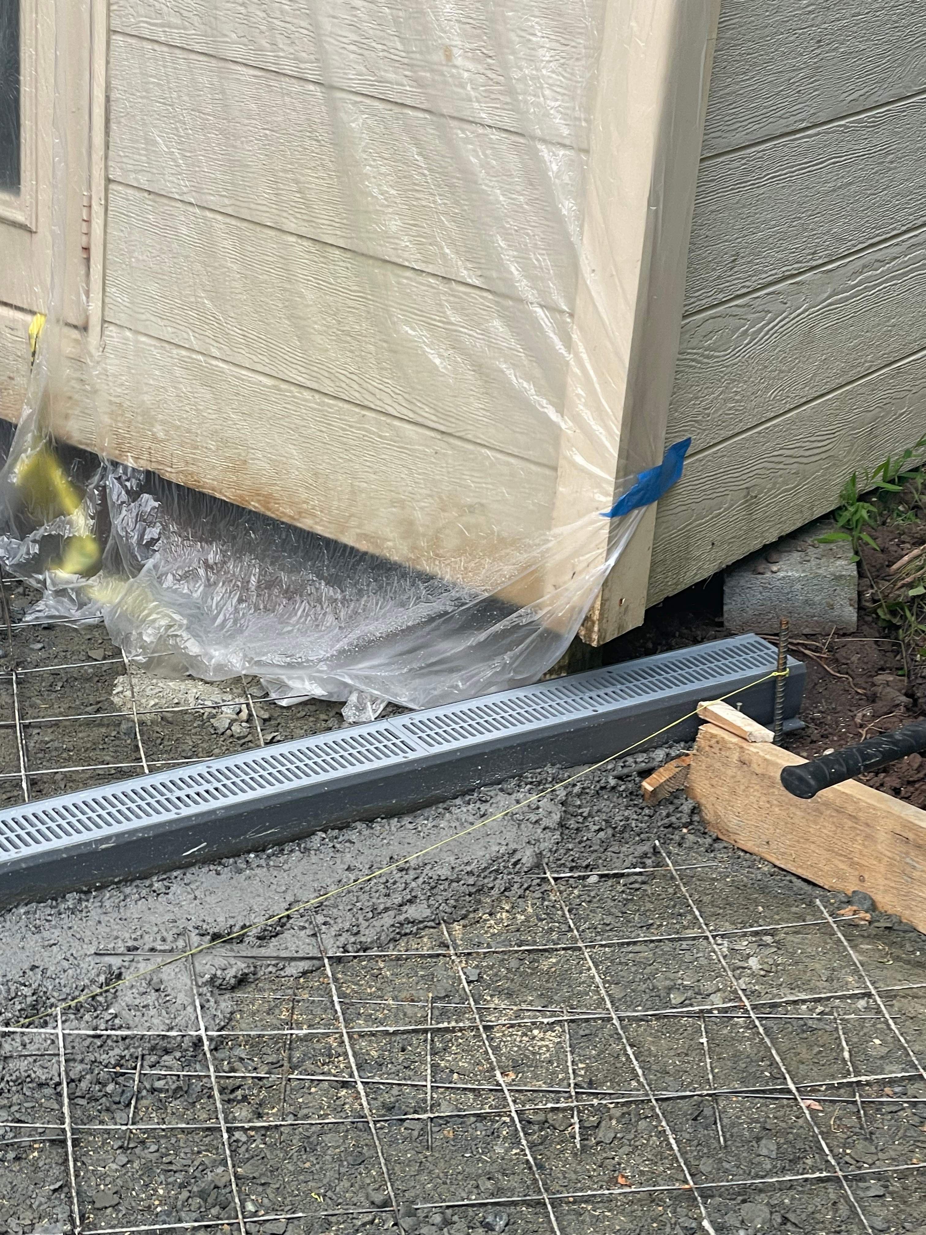 Pool Surround remodel with retaining walls, new waterfall and water slide by Fairfax Contractors, LLC