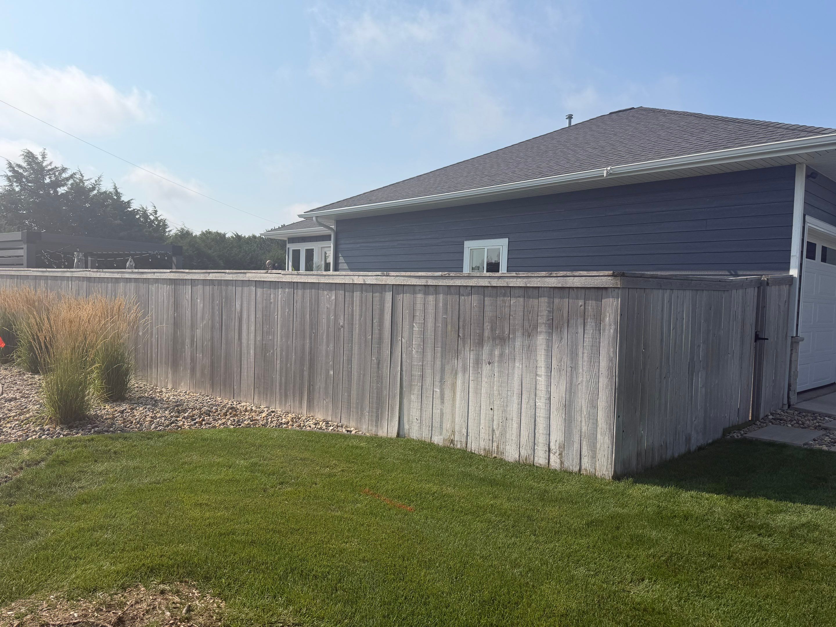Custom Privacy Fence and Paver Patio Installation in Sioux Falls by Select Painting, Coatings & Garage Cabinets