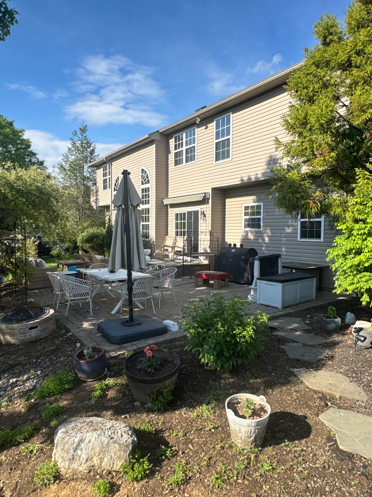 Backyard Retreat: Techo-Bloc Patio + Firepit Lounge by Saylor’s Lawn & Landscape
