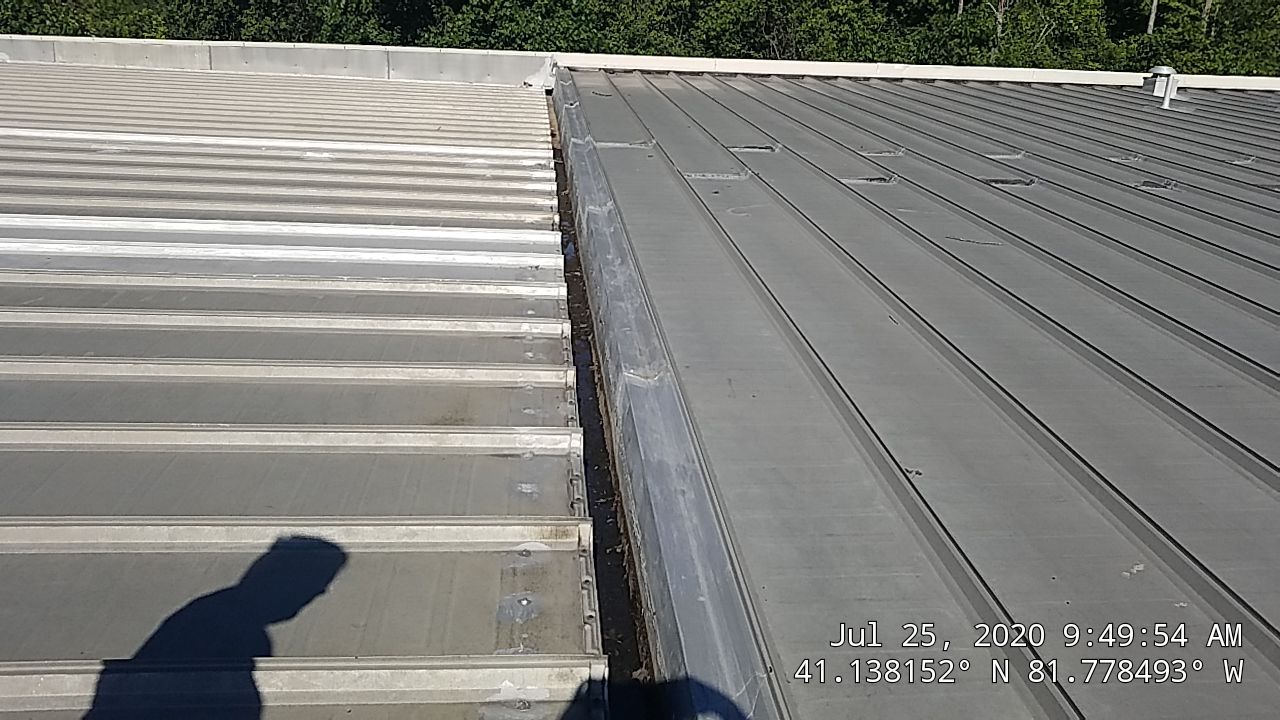 Commercial Metal Roof Coating by Gold Star Roofing LLC