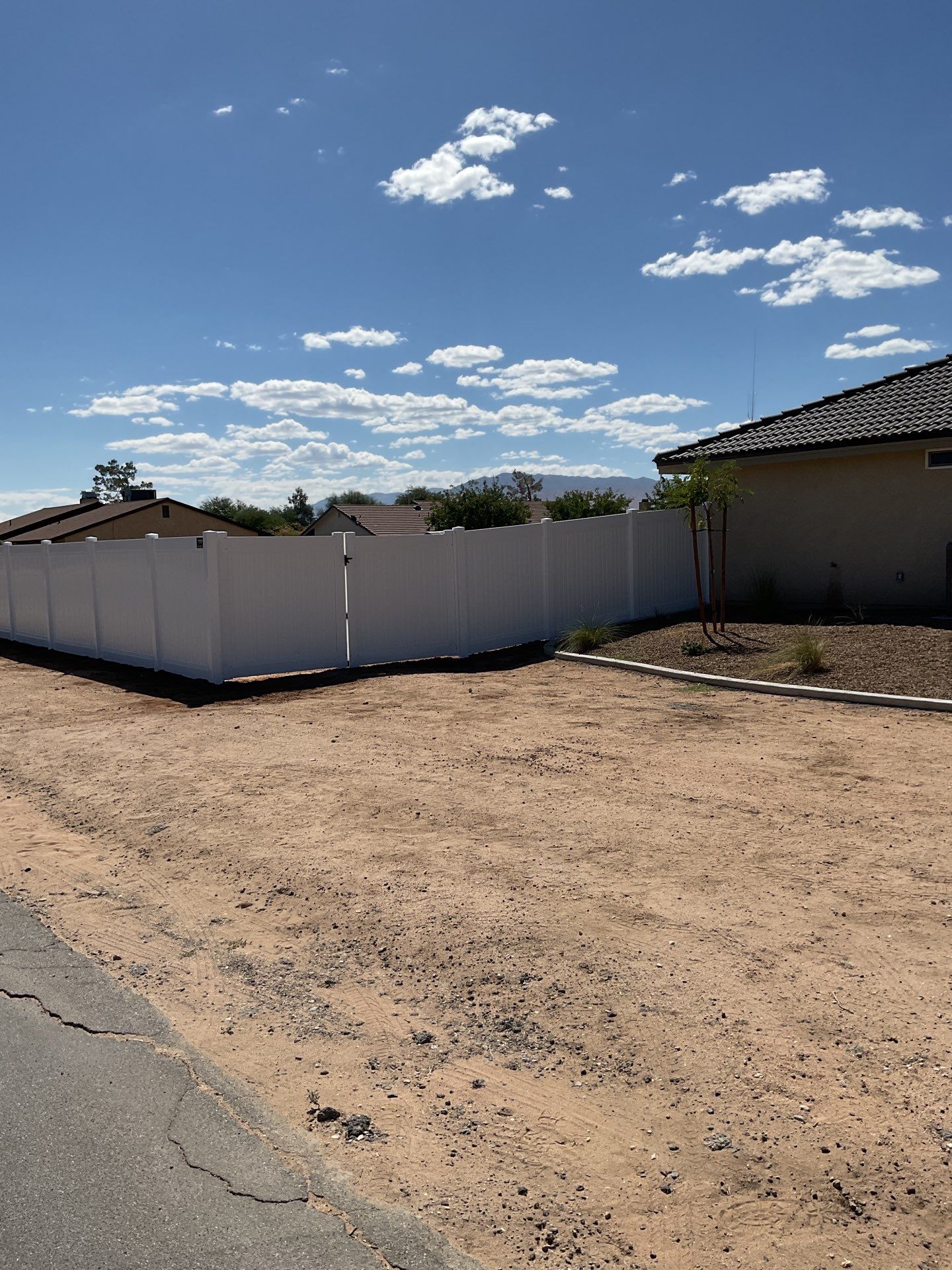 6ft White Privacy Vinyl Fence with Chain-link Fence by Fence Guys Inc.