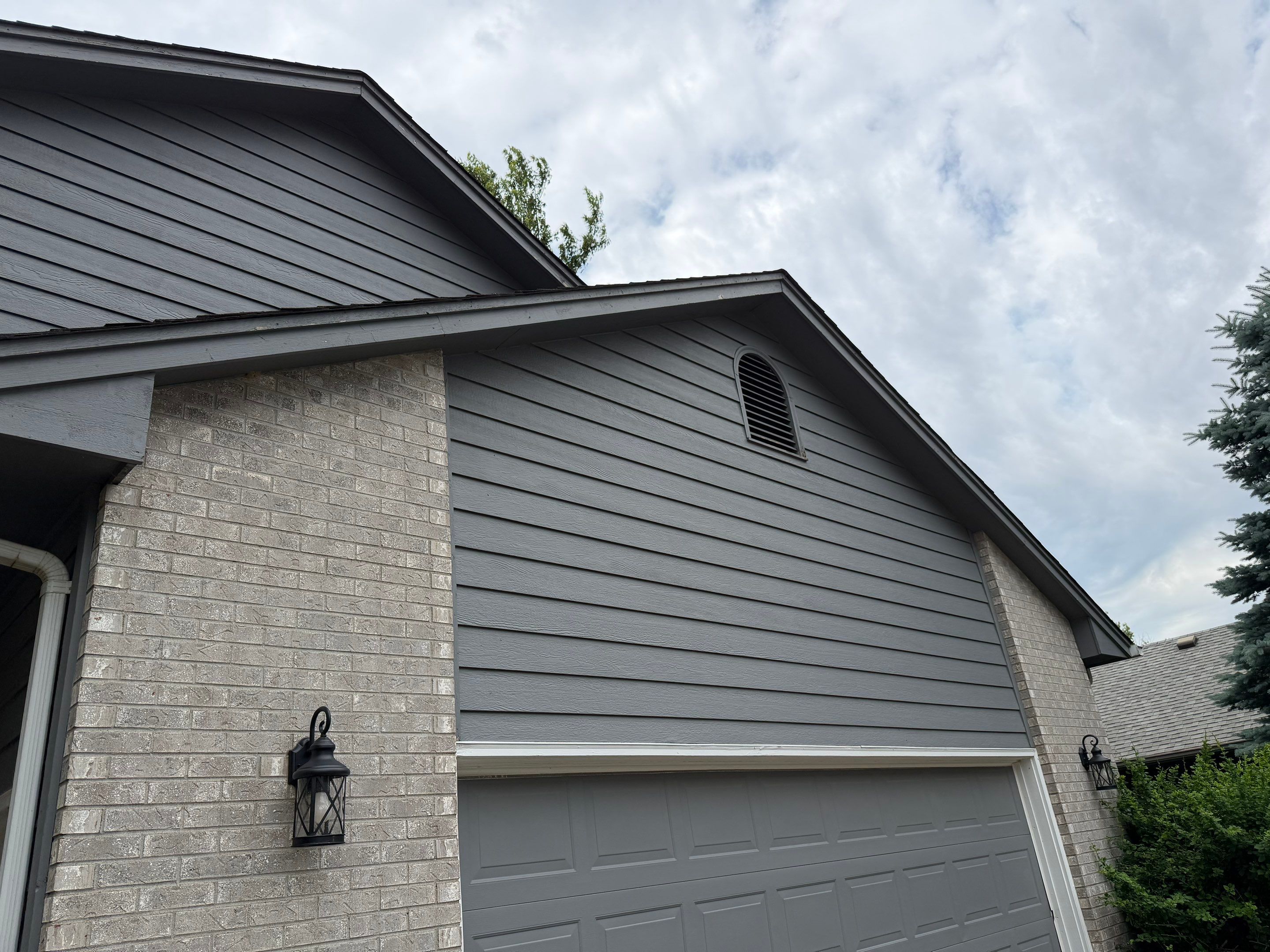 Full Exterior Painting for Gray Siding and Trim in Sioux Falls by Select Painting, Coatings & Garage Cabinets