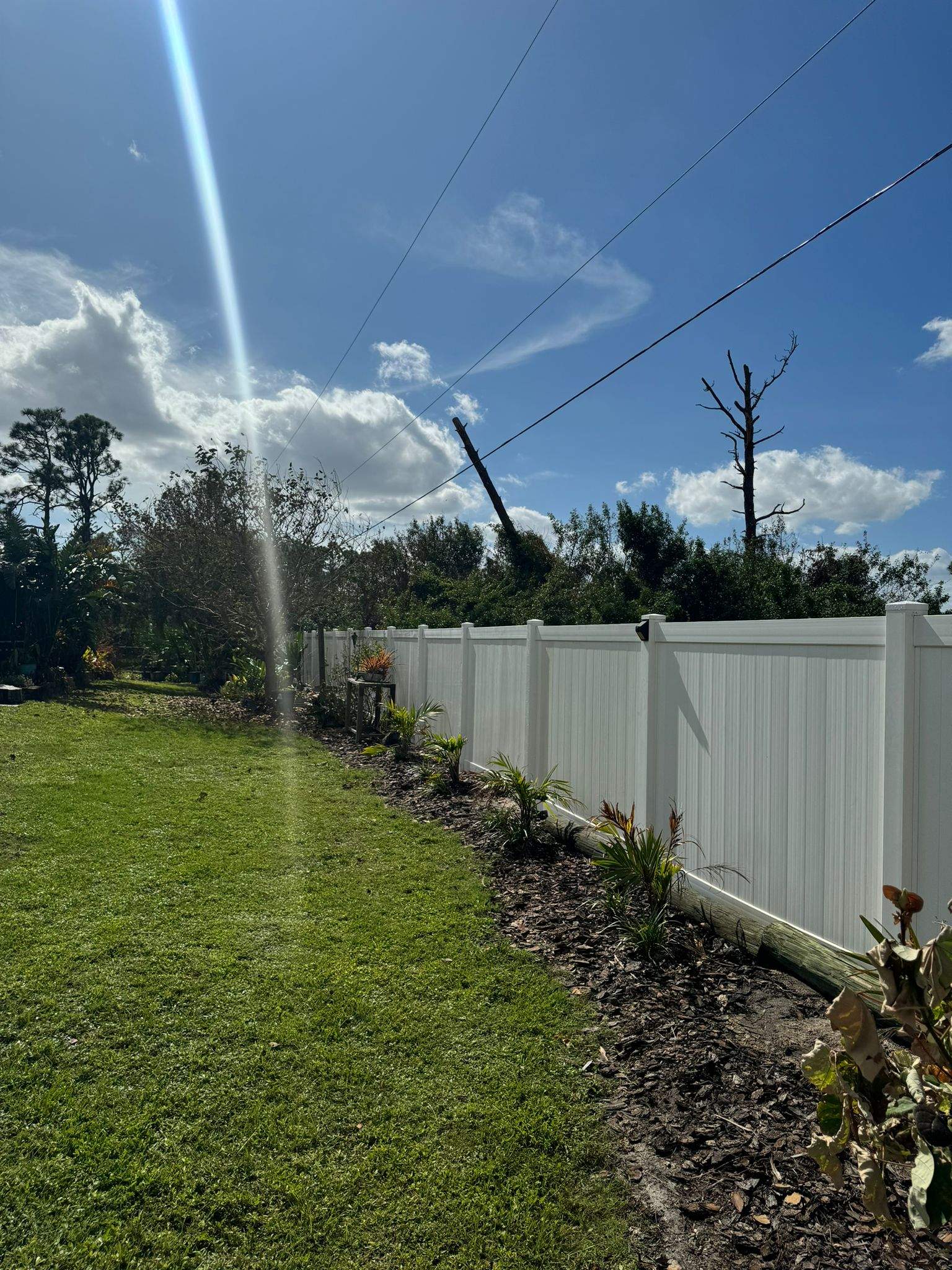 White Vinyl Privacy Fence Installation in Port Charlotte by True Fence LLC