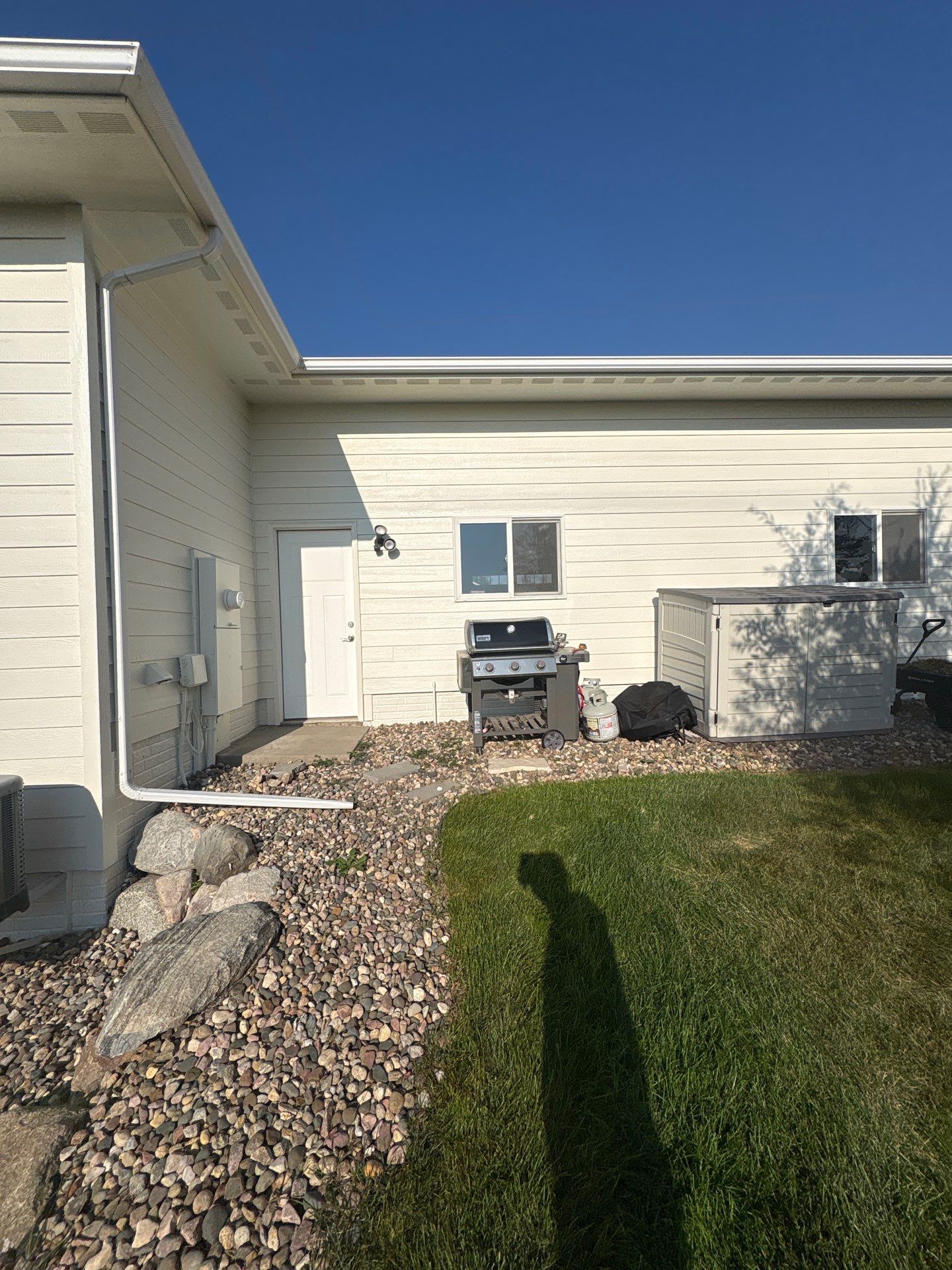Sioux Falls Exterior Residential Siding and Deck Painting Project by Select Painting, Coatings & Garage Cabinets