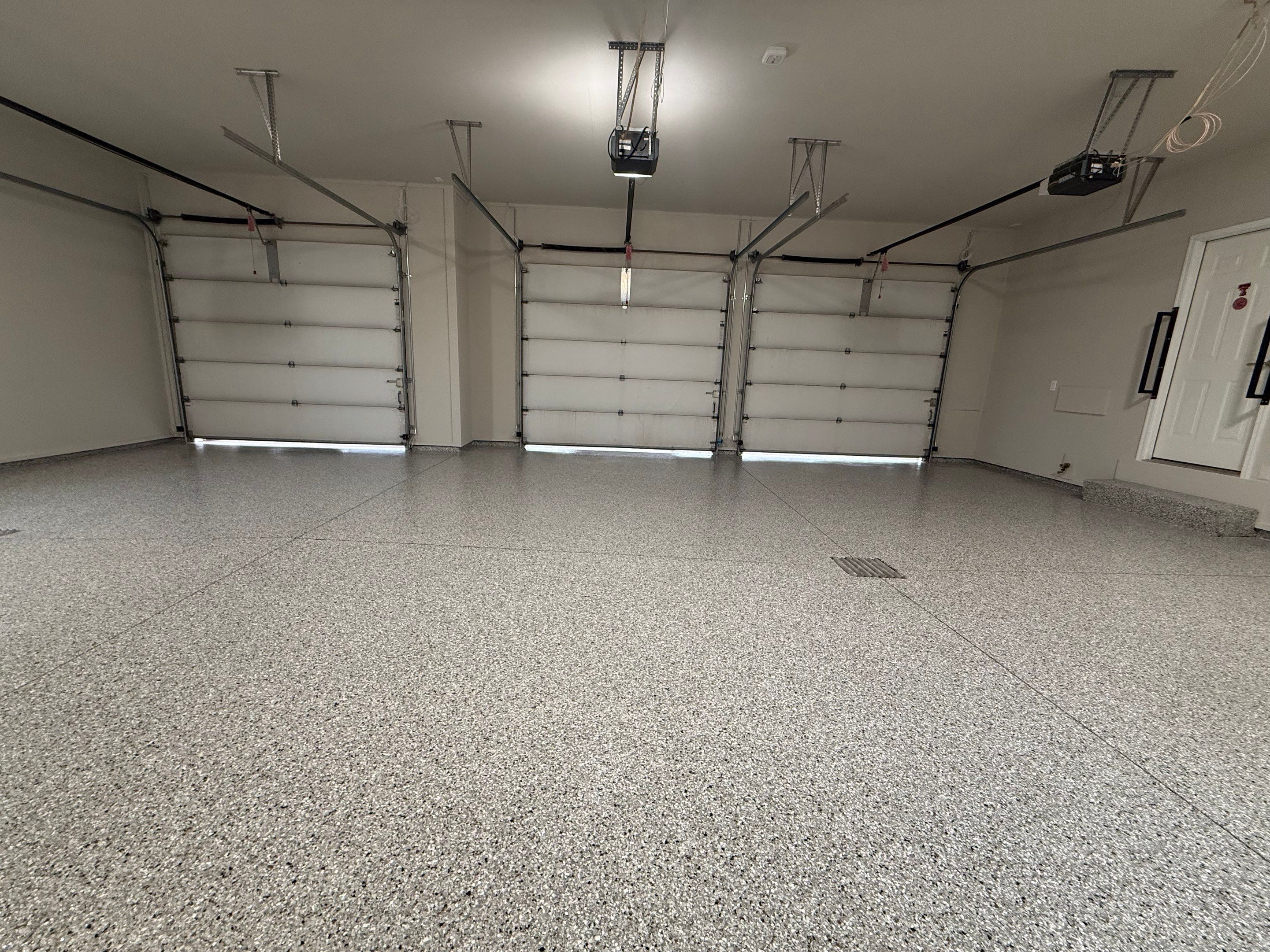 Garage transformation in Yankton by Select Painting, Coatings & Garage Cabinets