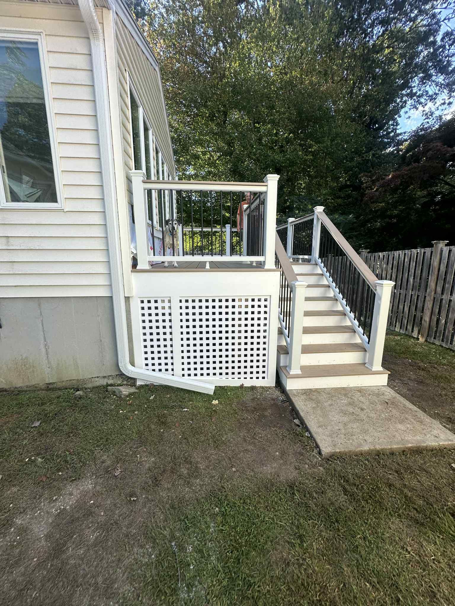 New Deck With Lattice enclosed bottom, Trex Lineage Carmel, Transcend cocktail rail.  by DiGiorgi Roofing and Siding Inc