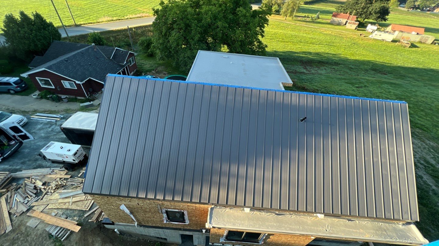 Residential Roofing Installation using multiple products by Top Notch Roofing Inc