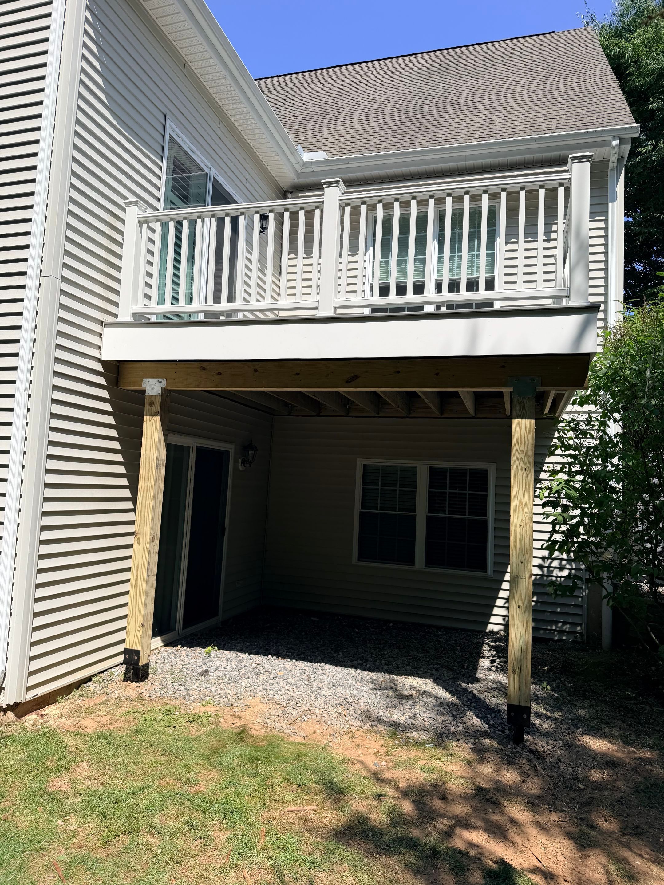 Deck replacement using trex select Millstone with transcend white railing. by DiGiorgi Roofing and Siding Inc