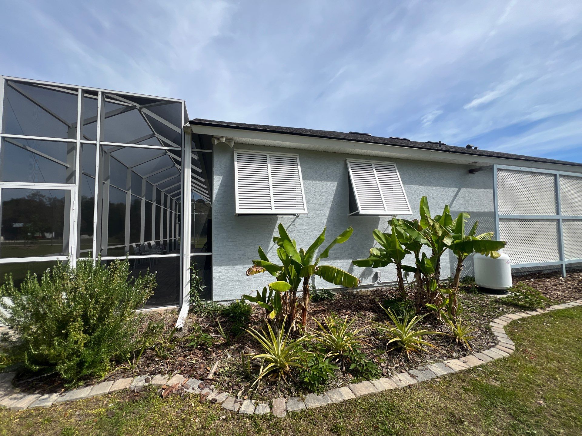 Decorative Bahama Shutters in Signal White by Smart Guard Shutters