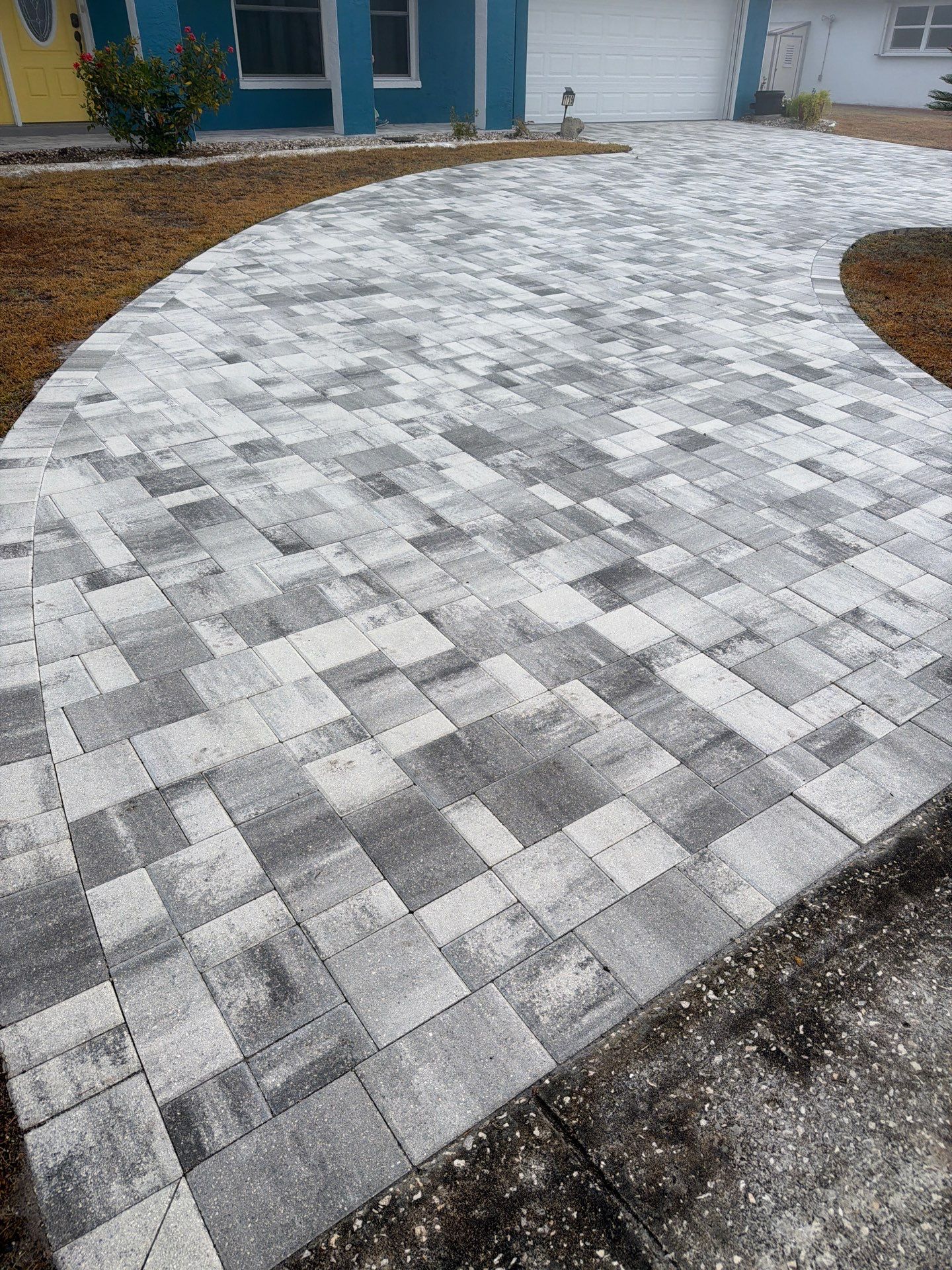 Modern Gray Paver Driveway and Entryway Walkway in Sun City Center by Supreme Paver Experts