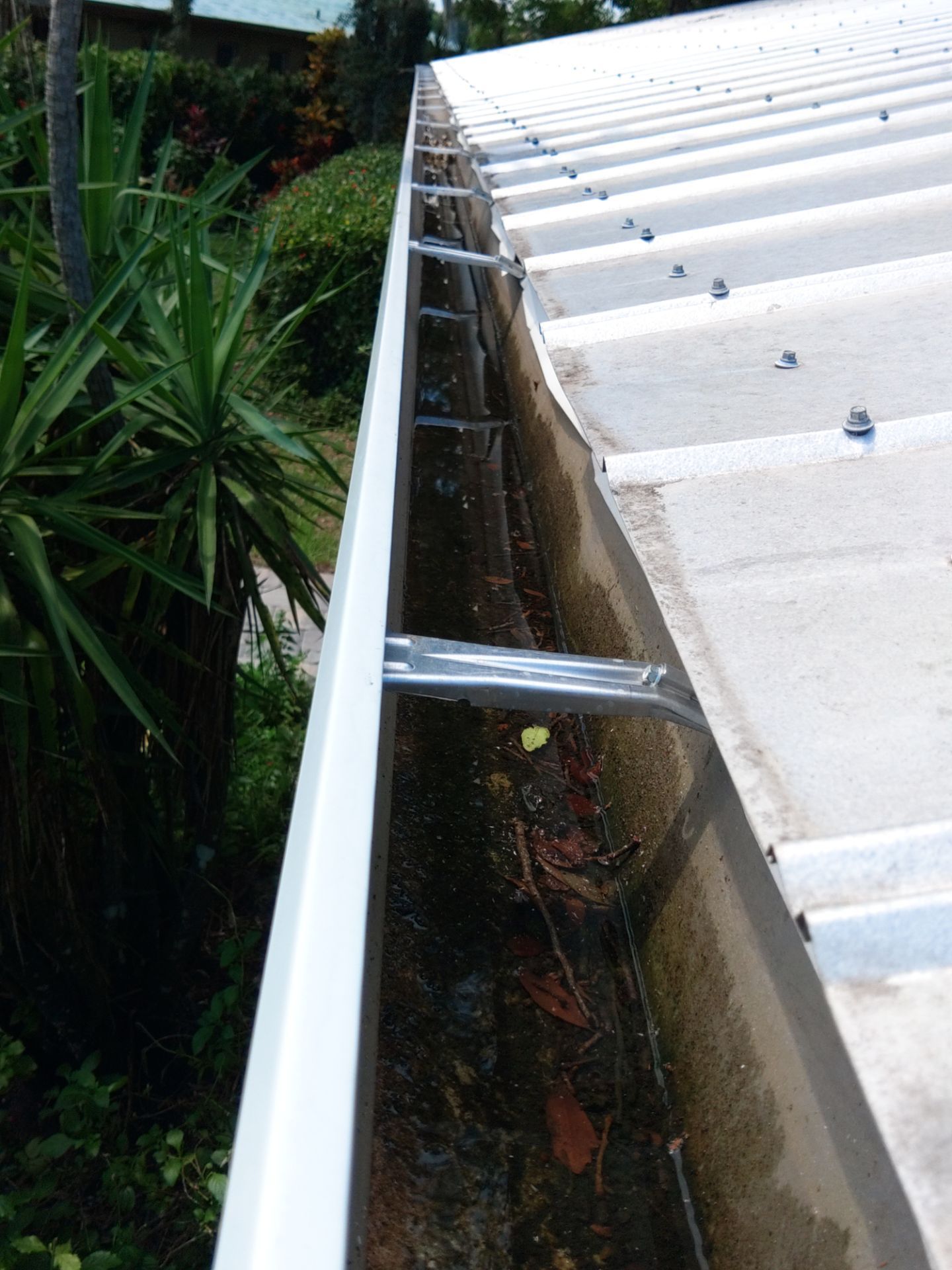 White 6-Inch Gutters and Leaf Guard Installation in Fort Myers FL by Gutter Professors