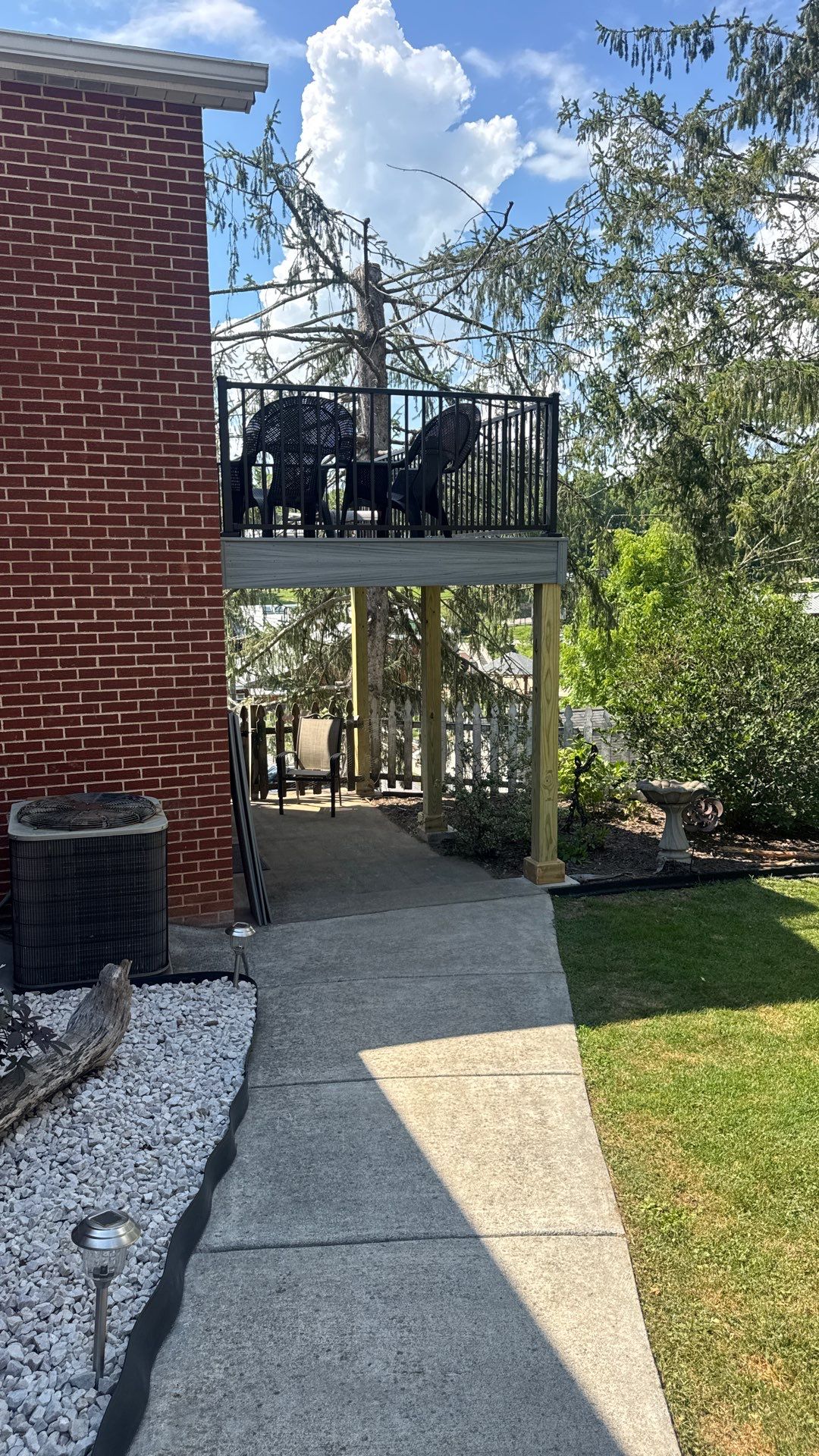 Elevated Composite Deck Rebuild with Black Metal Railing in Lewisburg by Walnut Hollow Decks & Outdoor Living