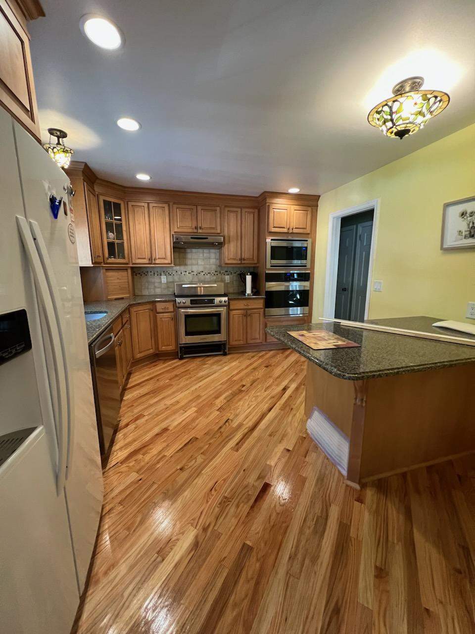 Sand and Refinish Red Oak Kitchen Floor by Footprints Floors Morristown
