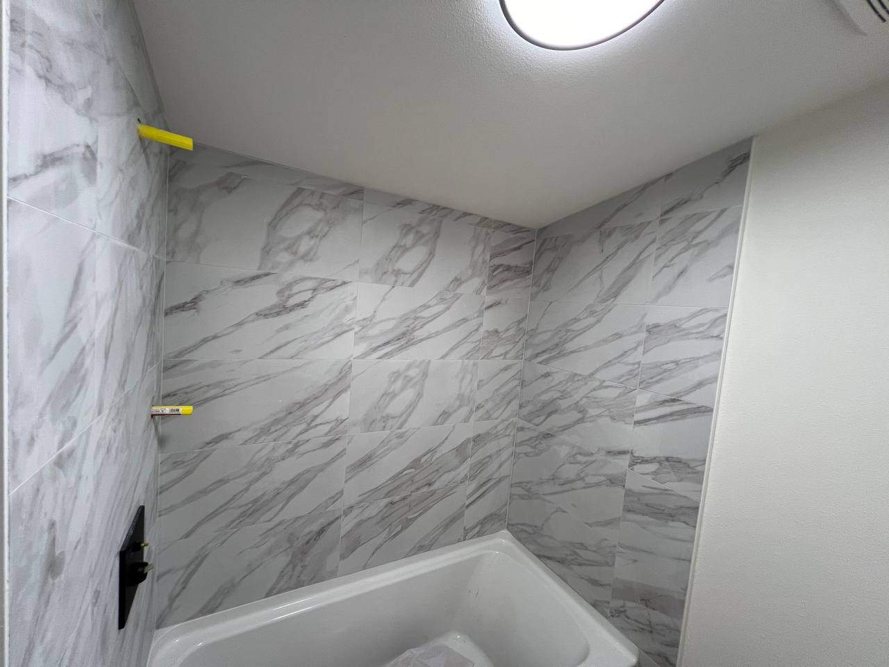 Shower wall tile by Handyman State LLC