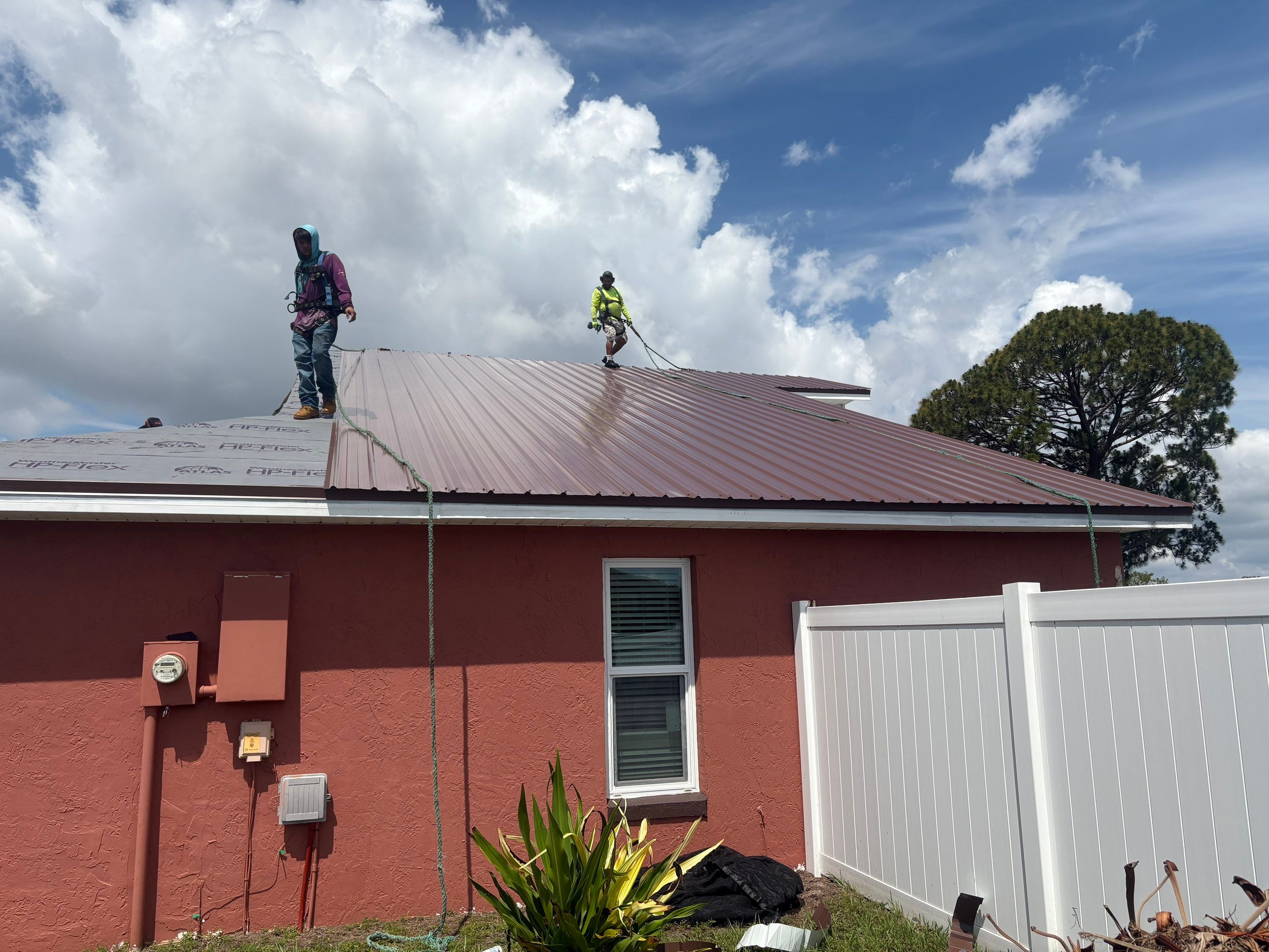 Residential Metal Roofing Installation and Gutter Replacement in Kissimmee by Pinnacle Roofing Group