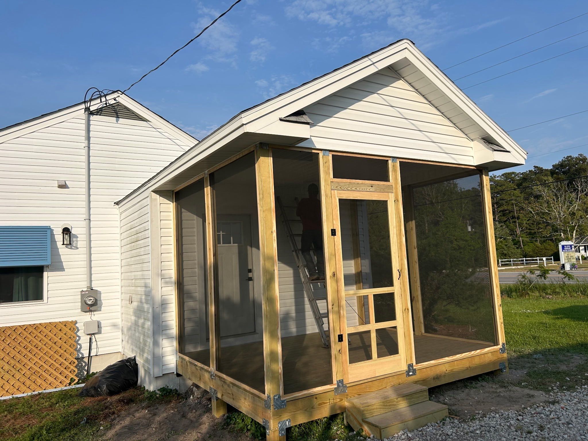 Custom Screened Porch and Deck Addition in Sea Level by The Remodeling Company