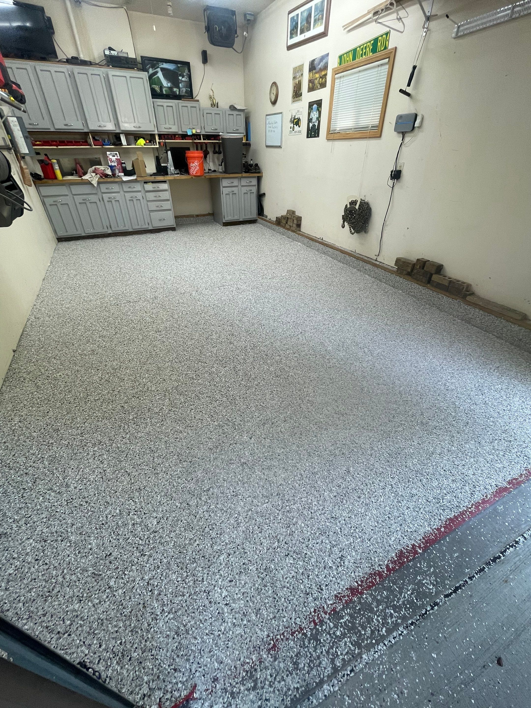 Multi-Stall Garage Floor Coating Installation in Sioux Falls by Select Painting, Coatings & Garage Cabinets