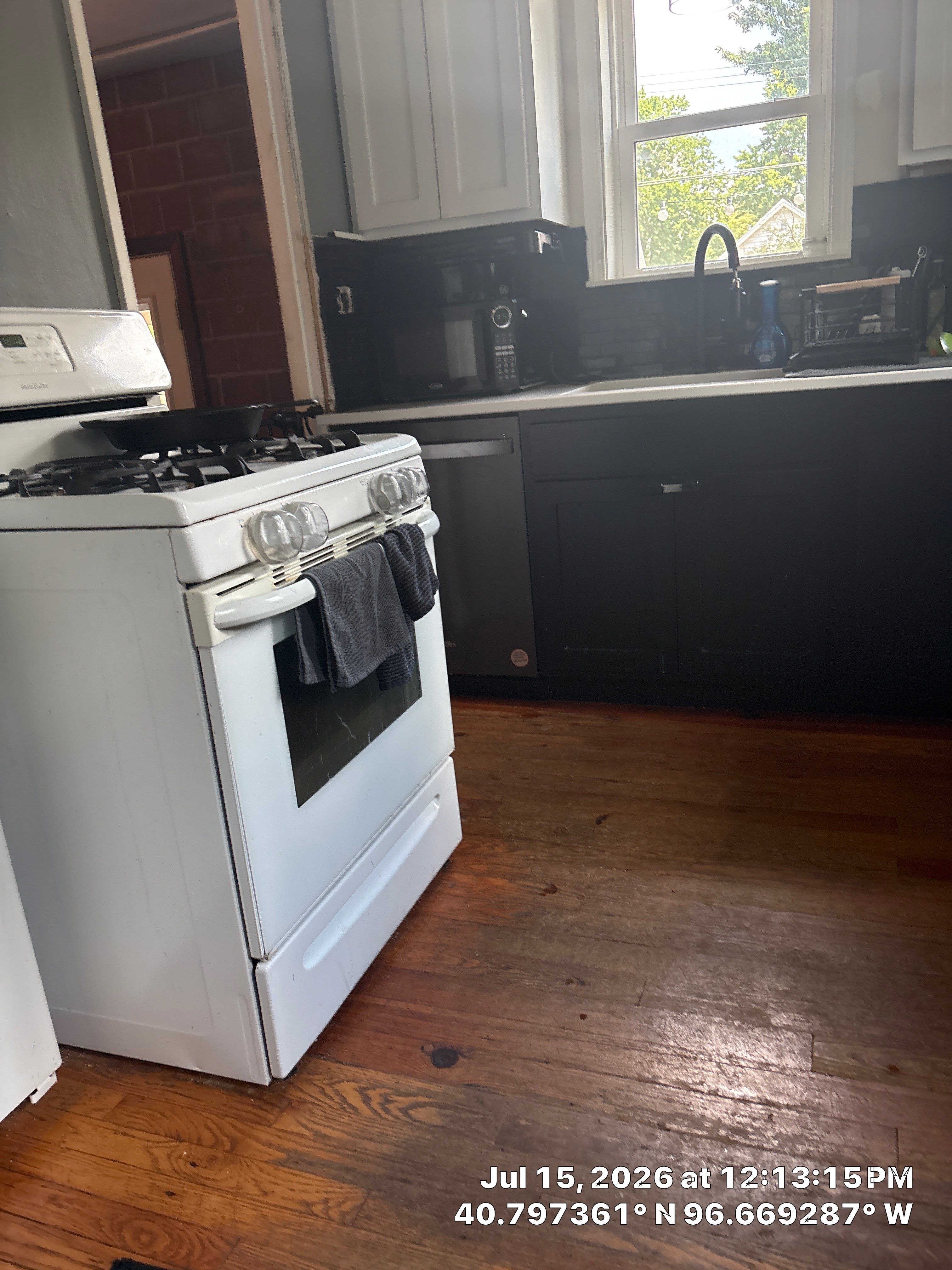 Modern Lincoln Kitchen Renovation Featuring Matte Black and White Cabinetry by CompanyCam Sales Demo