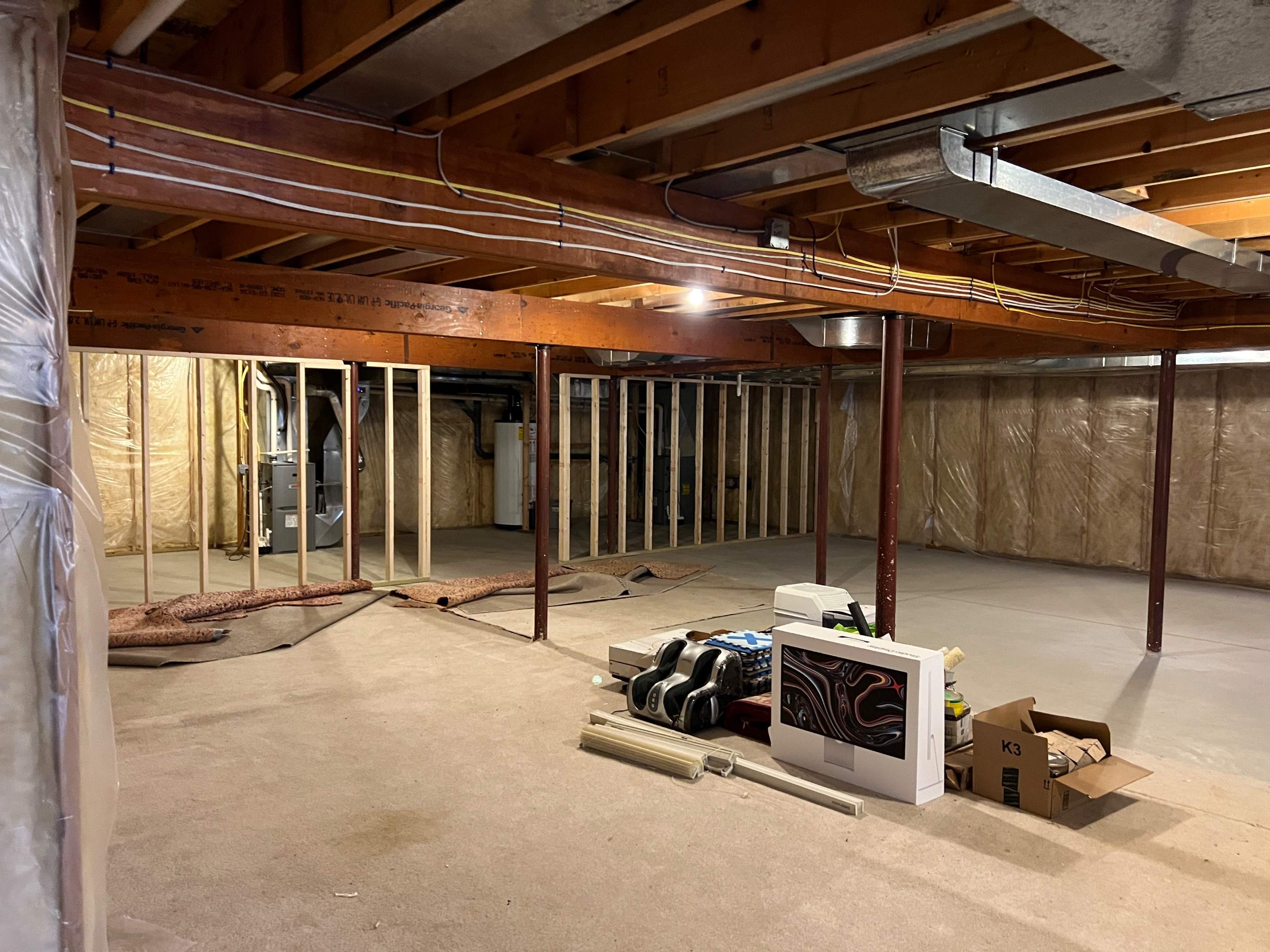 Basement Remodel w/ LVP Flooring & Exposed Ceiling by Chagnon Building & Remodeling LLC