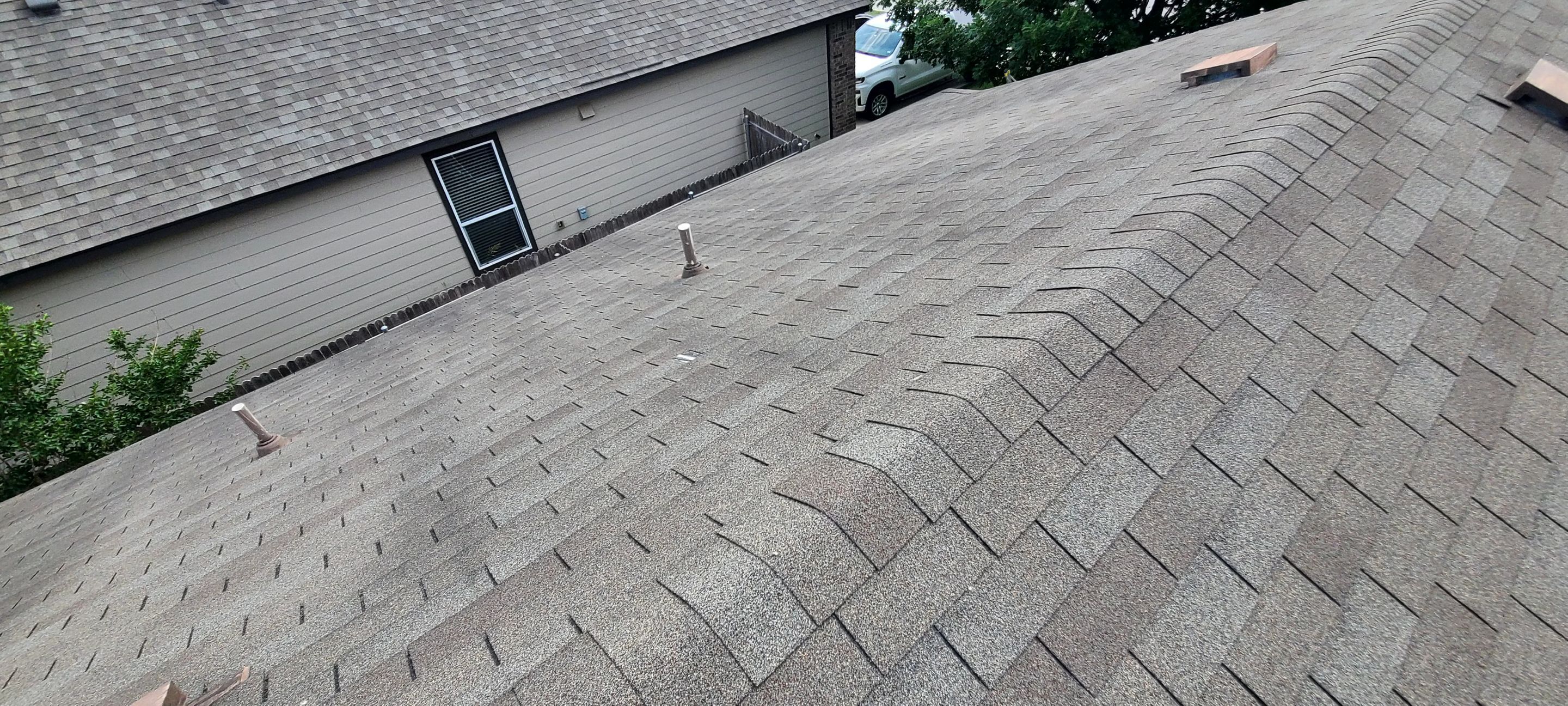 Asphalt Shingle Roof Replacement and Window Glazing in Manor by Caliber Restoration LLC