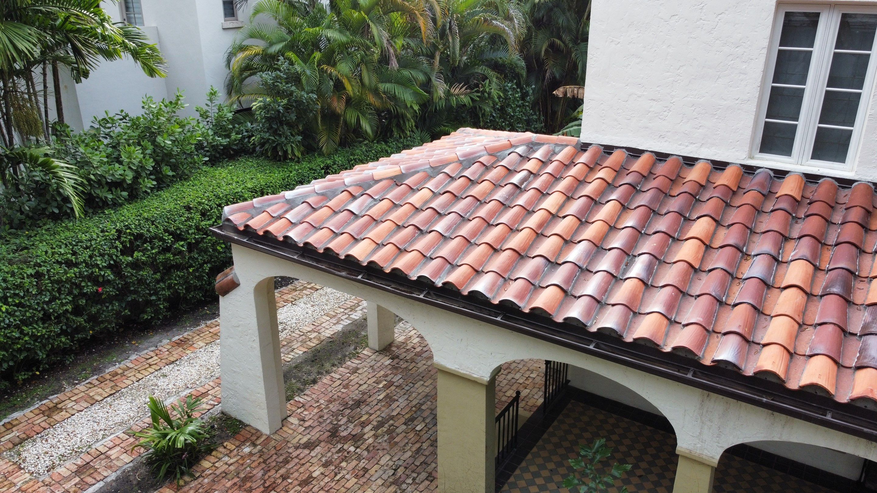 Residential Roofing Installation using Two Piece Clay Barrel Tile with a mortar set application by BOB HILSON & CO INC