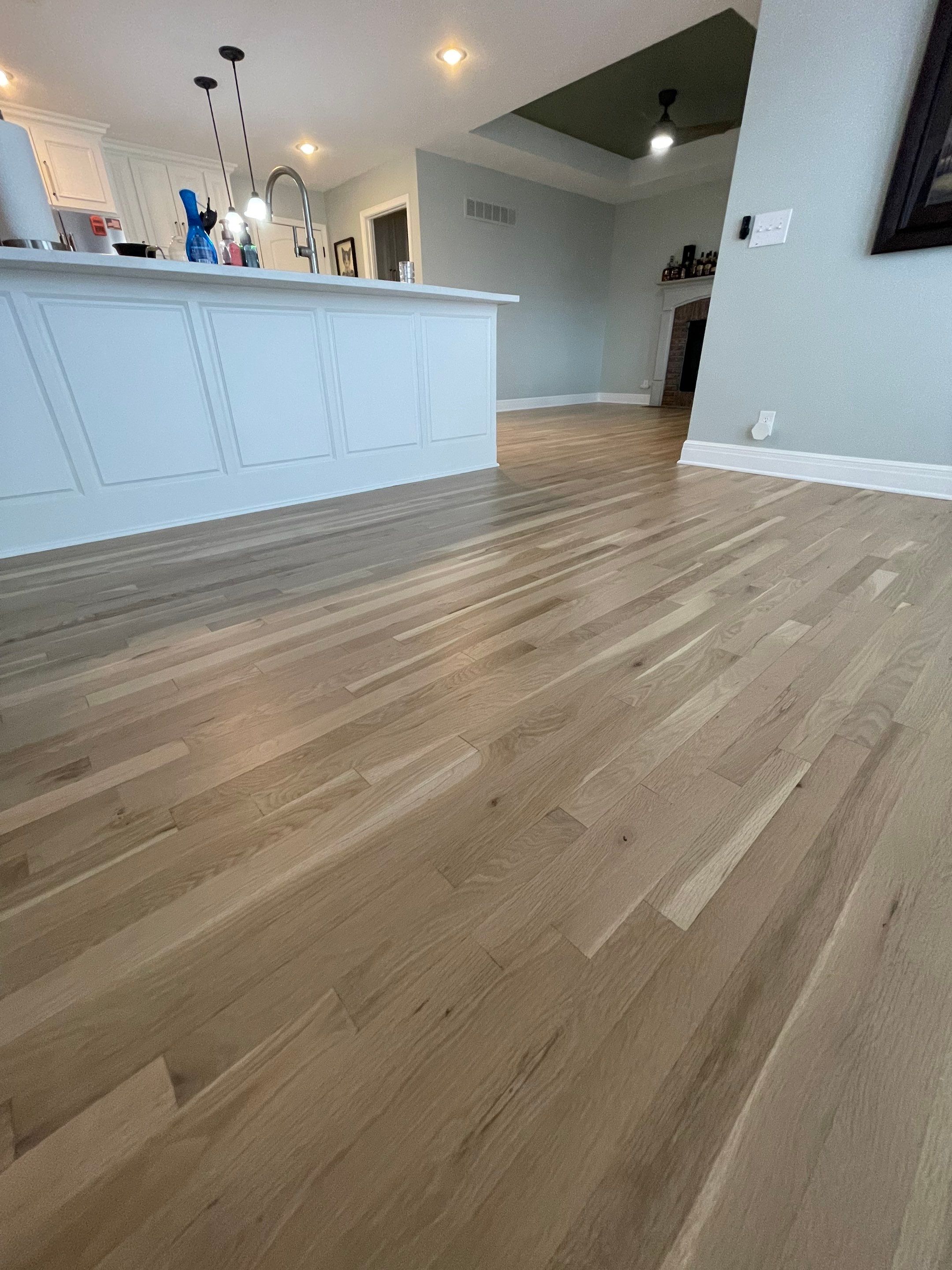 Hardwood Flooring Installation and Baseboard Trim in Grain Valley by Rippnfinish