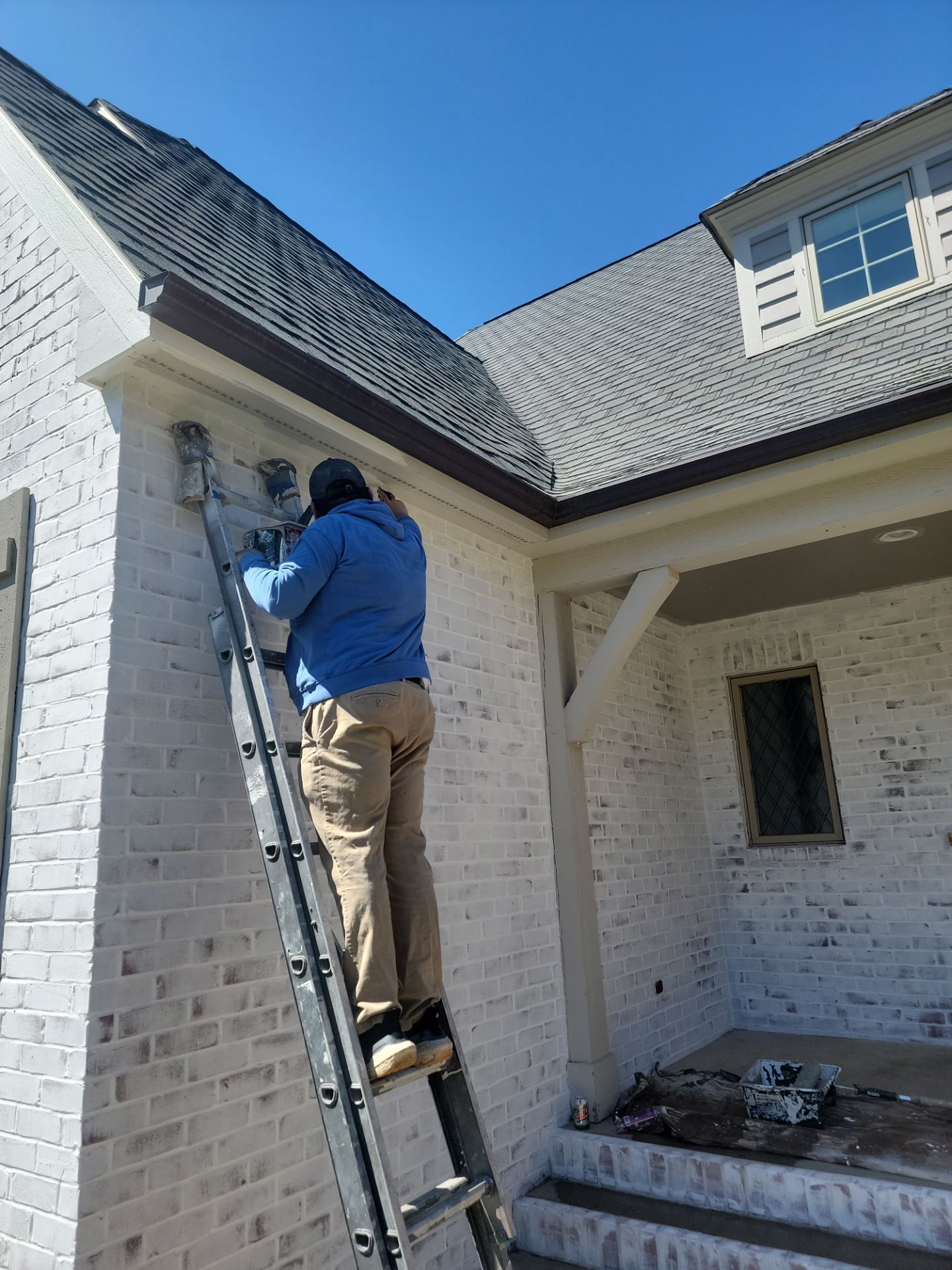 Residential Exterior Brick Painting and Limewash Refresh in Sioux Falls by Select Painting, Coatings & Garage Cabinets