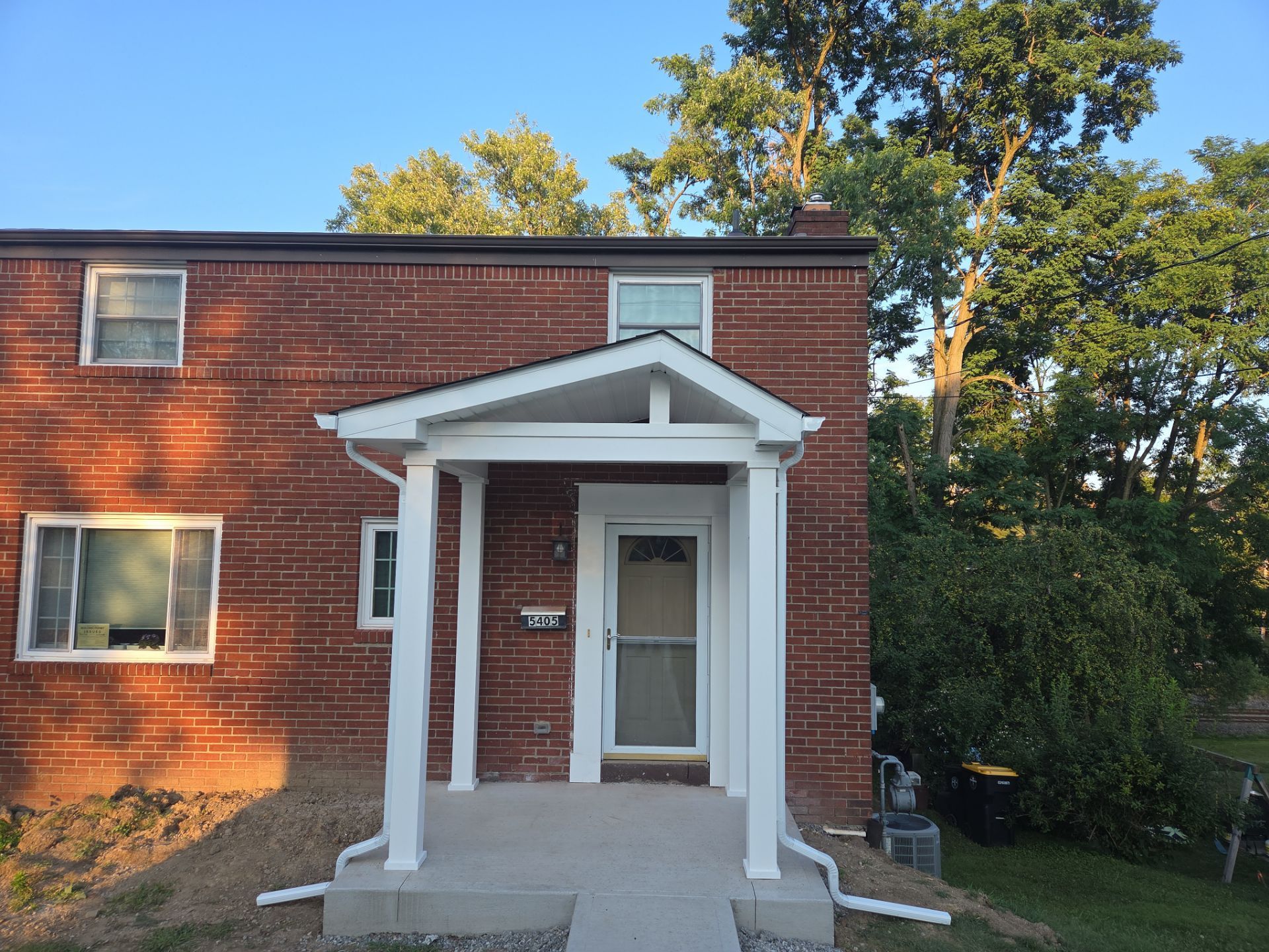 Concret and roof build  by Cousins Roofing Siding & Decks