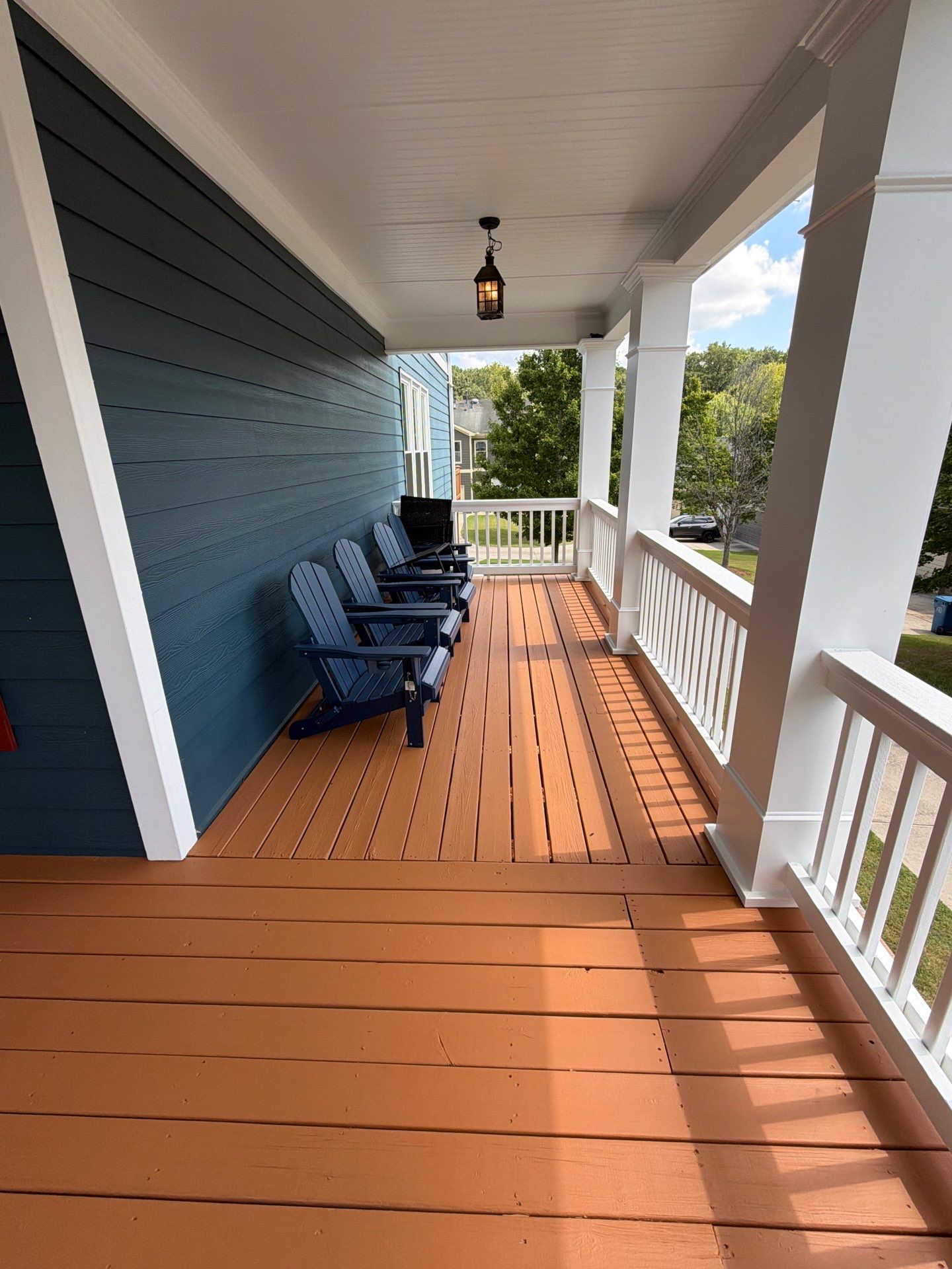 Atlanta Exterior Home Refresh with Blue Siding and Deck Staining by Swift Home Renovations 