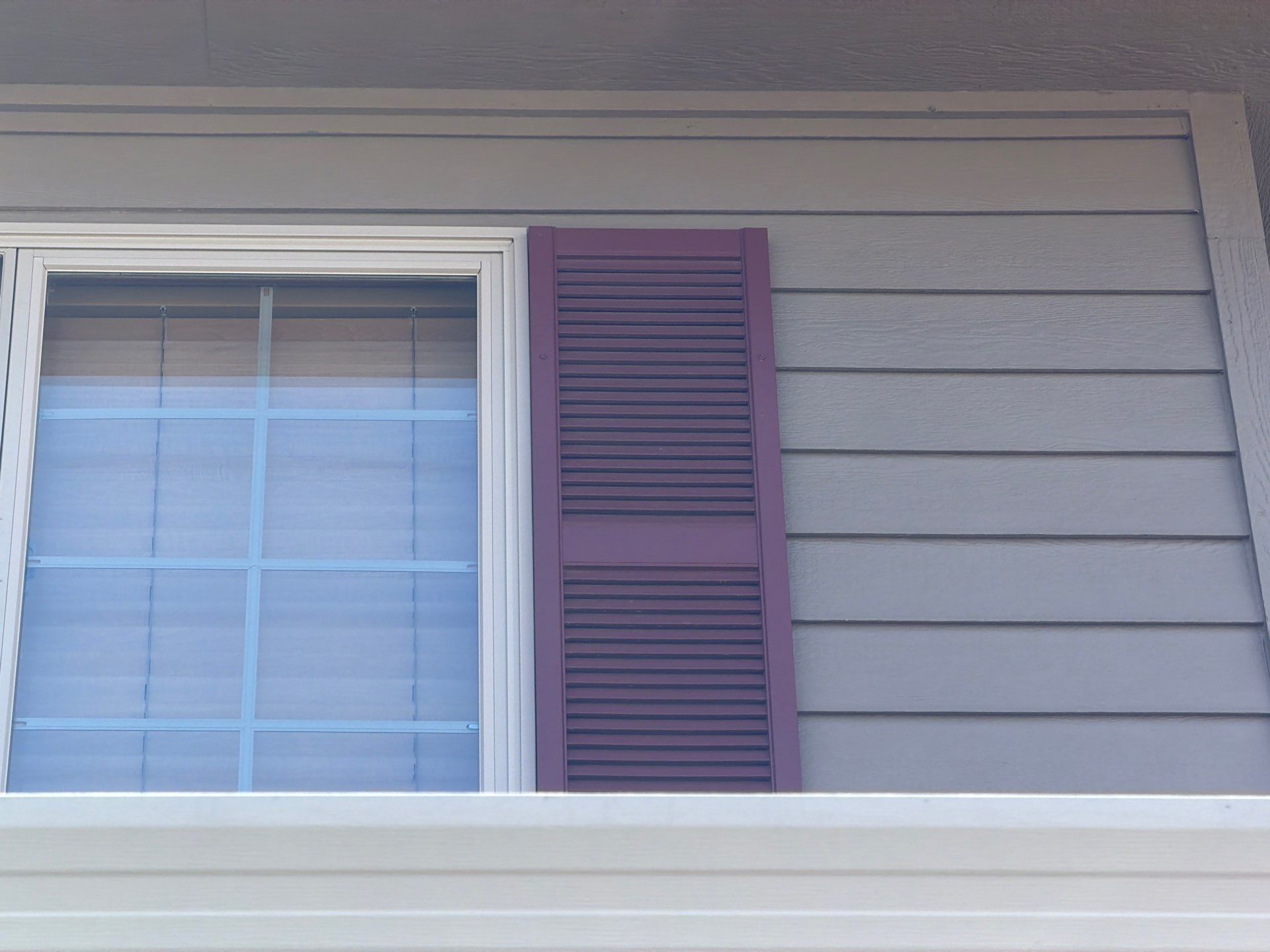 Residential Exterior Painting with Shutter and Trim Updates in Sioux Falls by Select Painting, Coatings & Garage Cabinets