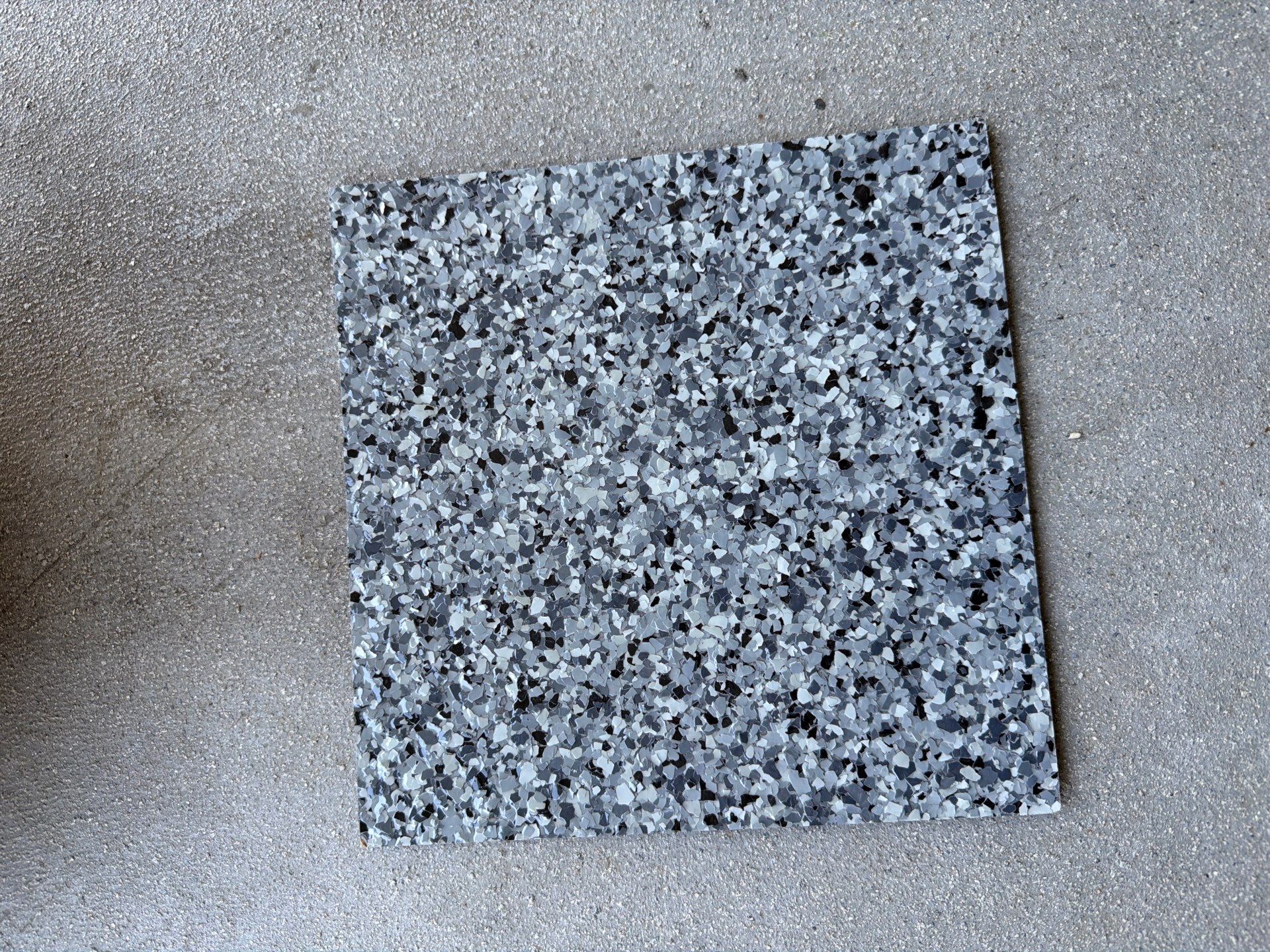 Sioux Falls Garage Floor Coating with Nightfall Decorative Chips by Select Painting, Coatings & Garage Cabinets
