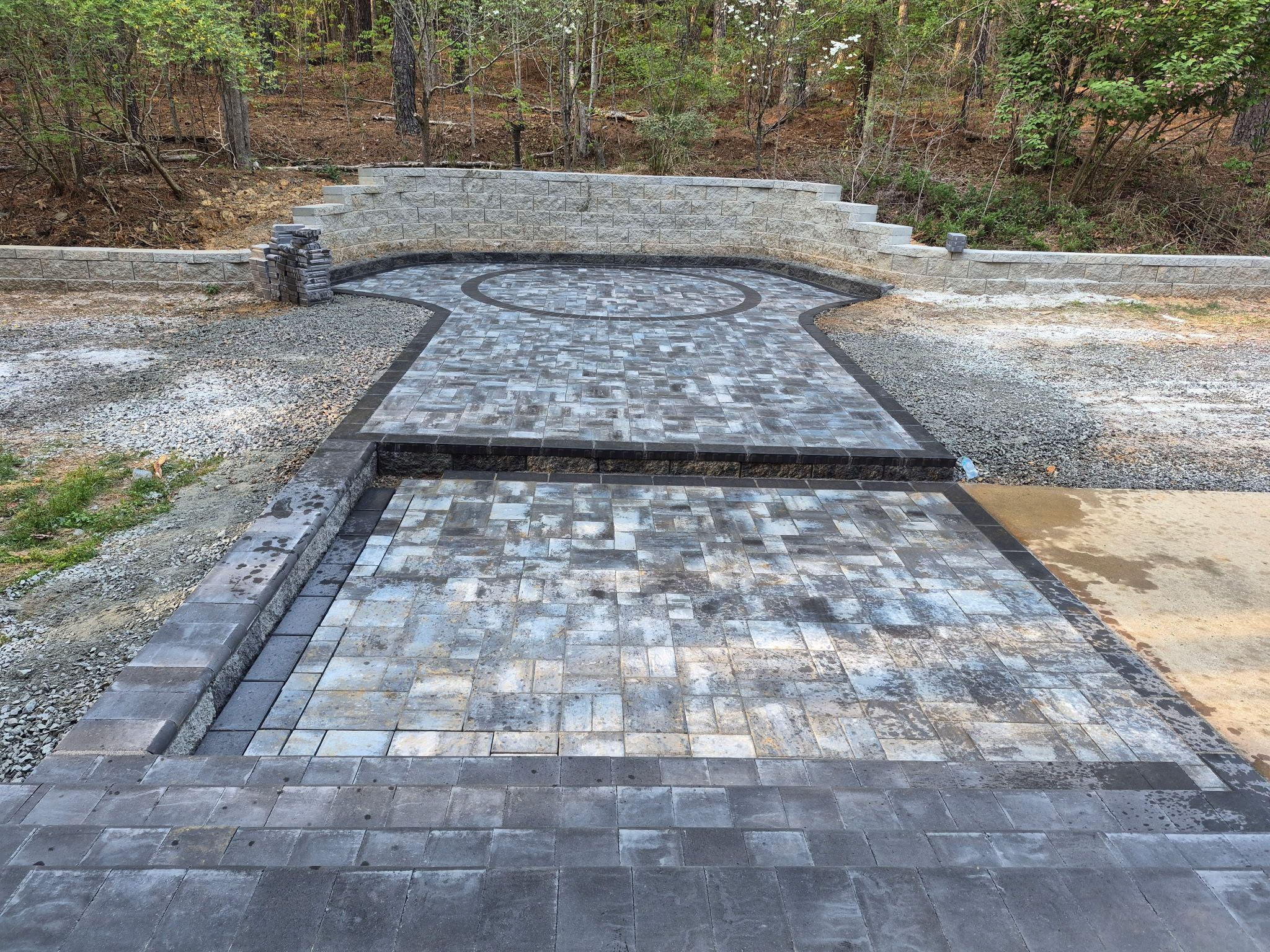 Pittsboro Outdoor Living Transformation – Retaining Wall, Paver Patio & Elevated Deck by Elite Remodeling and Design LLC