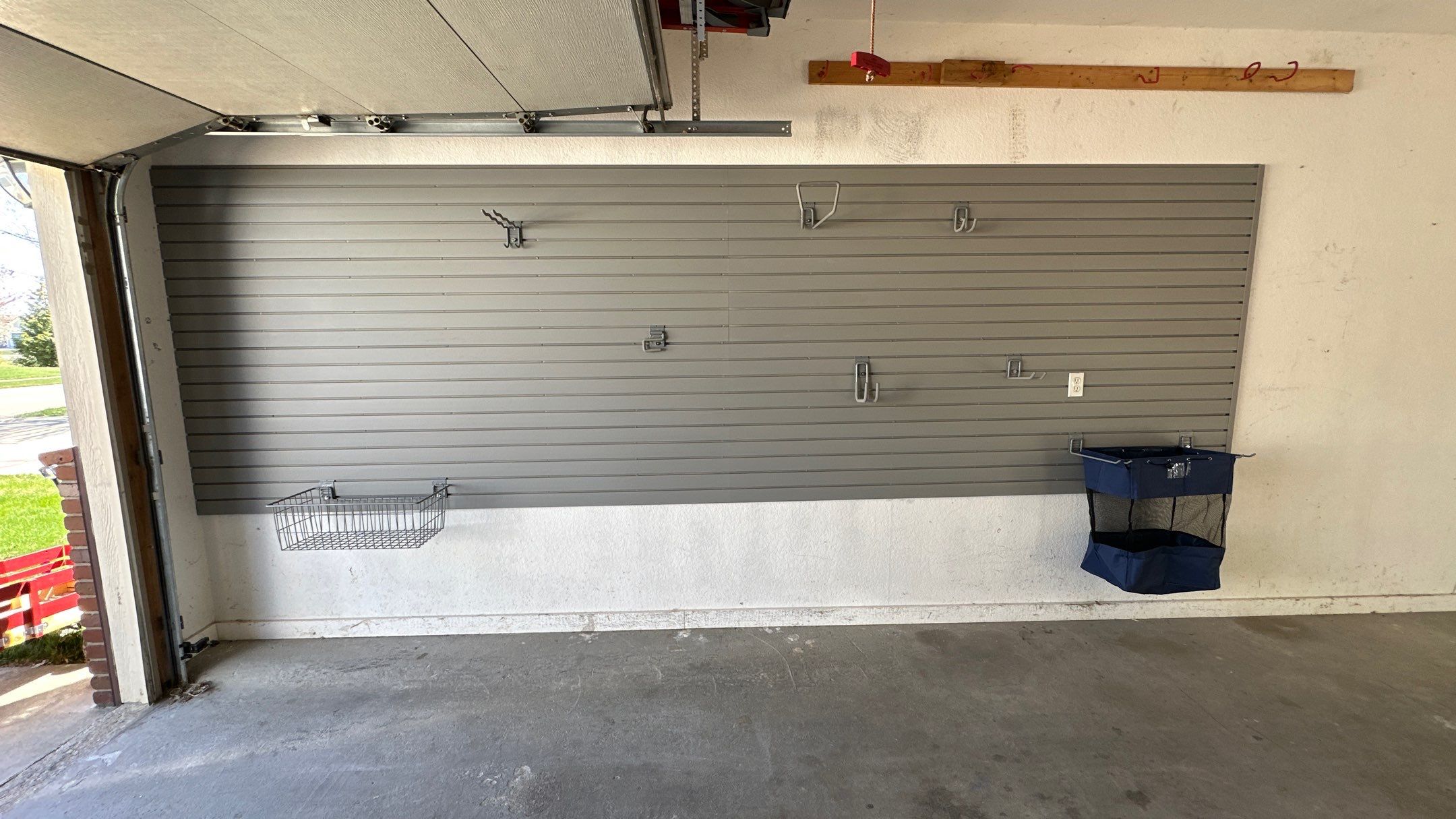 Melissa L. upgraded her garage with slatwall and overhead racks by Banner Garage
