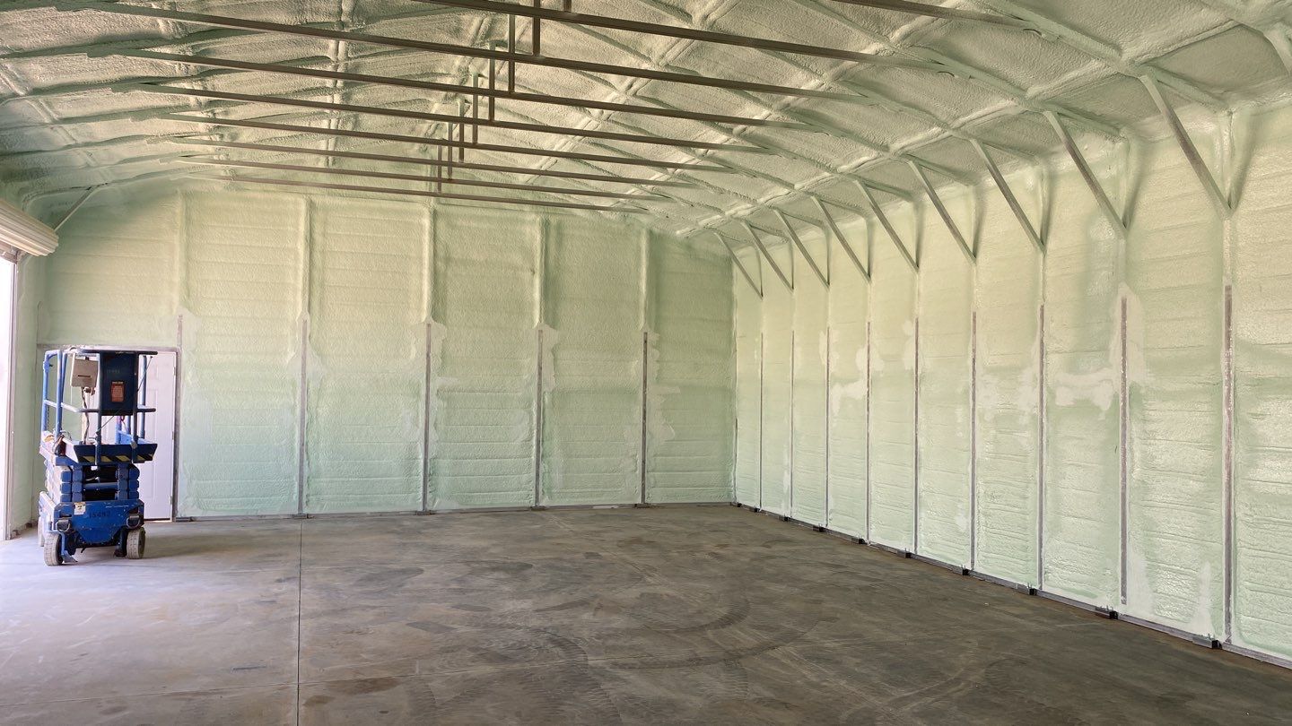 Foam insulation installed in shop by Straight Edge Roofing Inc