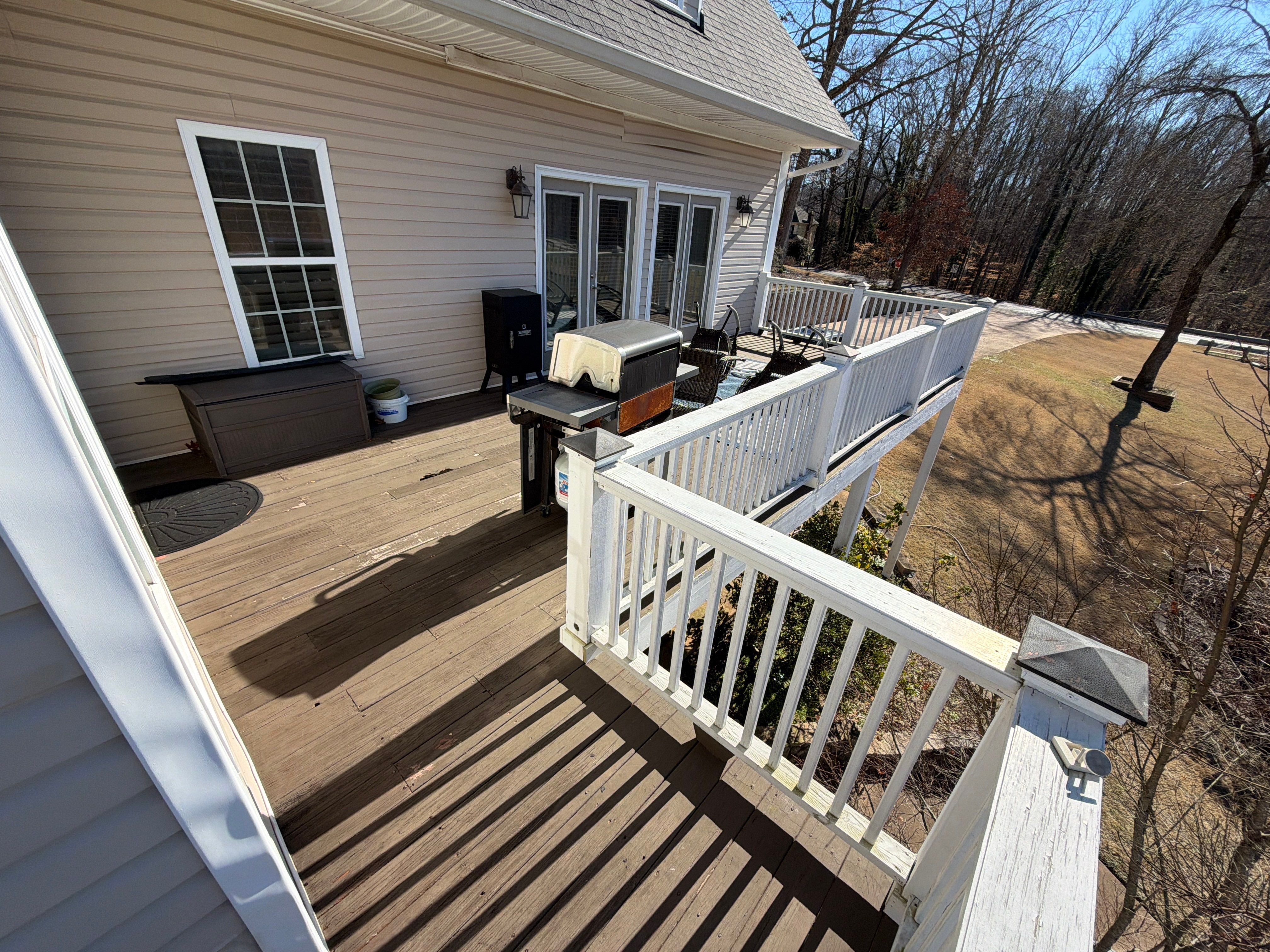 Cumming, GA Lake House Deck Resurface and Extension using Pressure Treated Pine and Skyline Cable Railing by Nelson Exteriors 