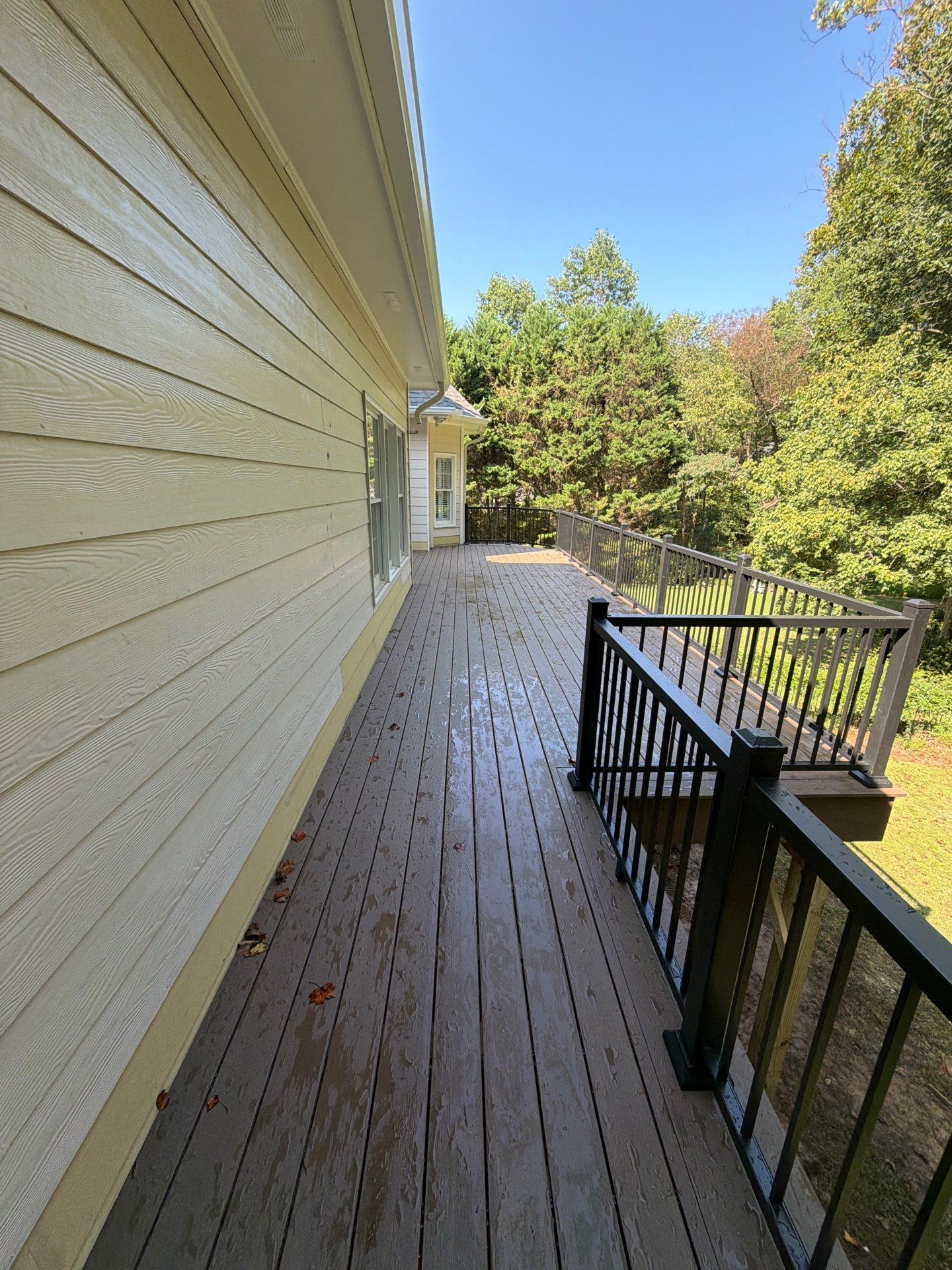 Elevated Composite Deck Replacement with Metal Railings in Smyrna by Swift Home Renovations 