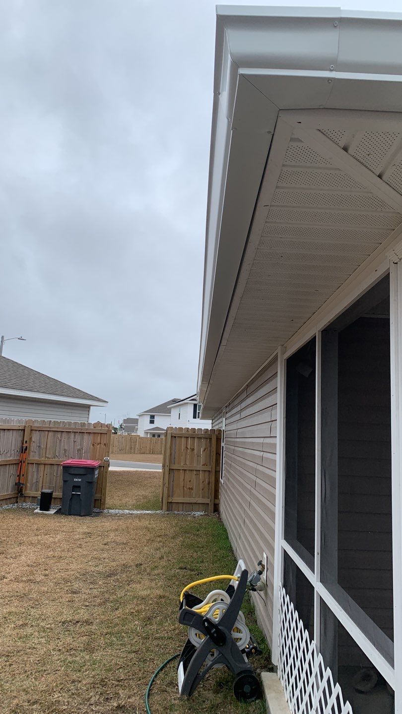 Seamless Gutter Installation Using White 6 Inch Gutters by Gutter Professors