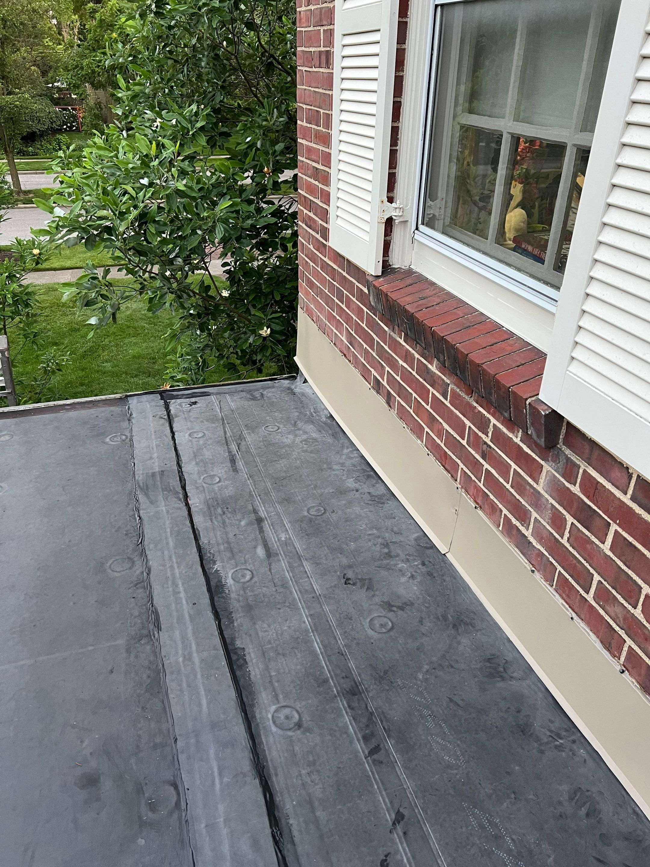 Residential Roofing Installation using 60 mil rubber roof  by Nitro Roofing and Construction