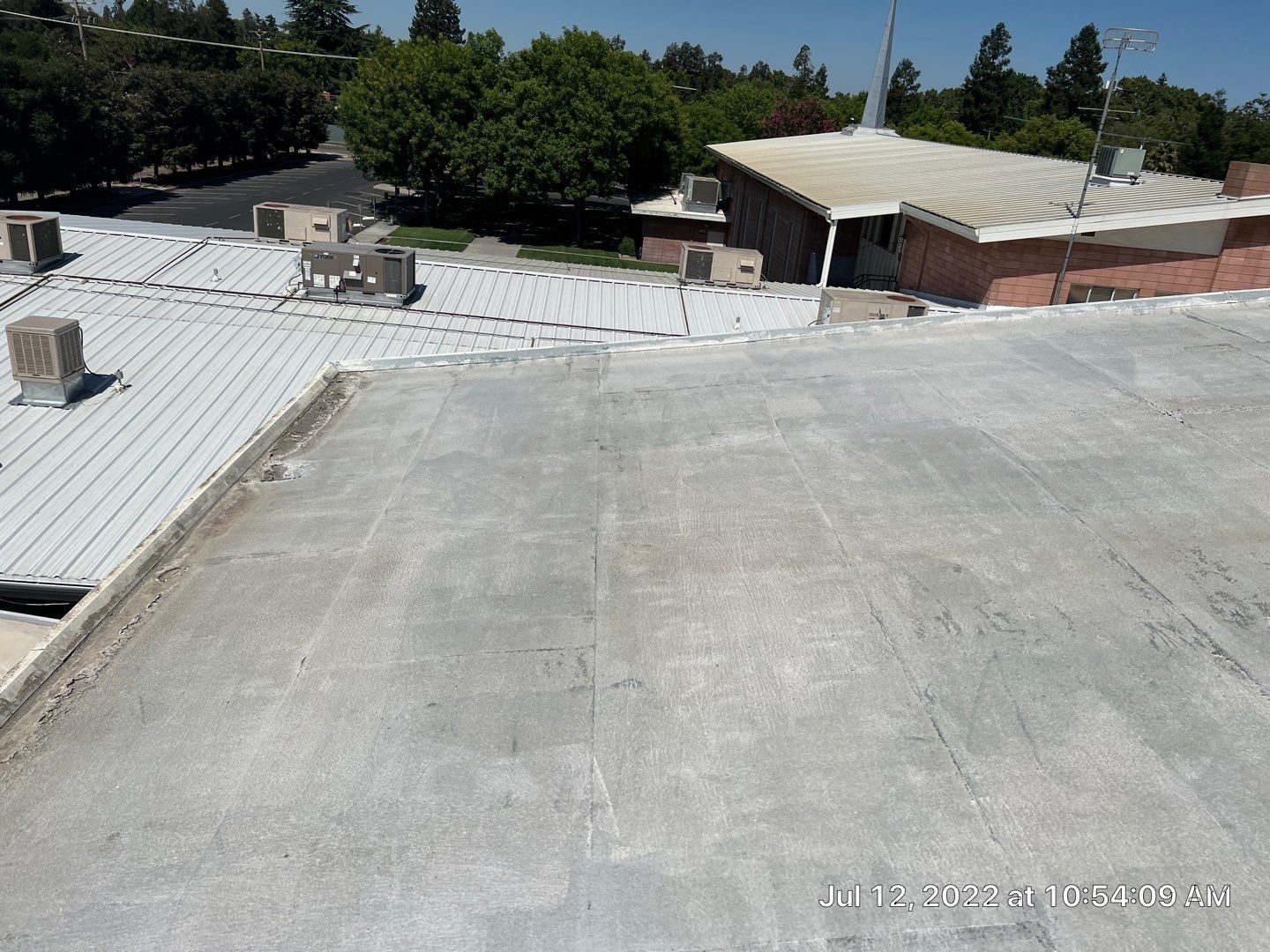 MR Roofing system using Benchmark/PUMA XL coatings over TPO single-ply roofing by Straight Edge Roofing Inc