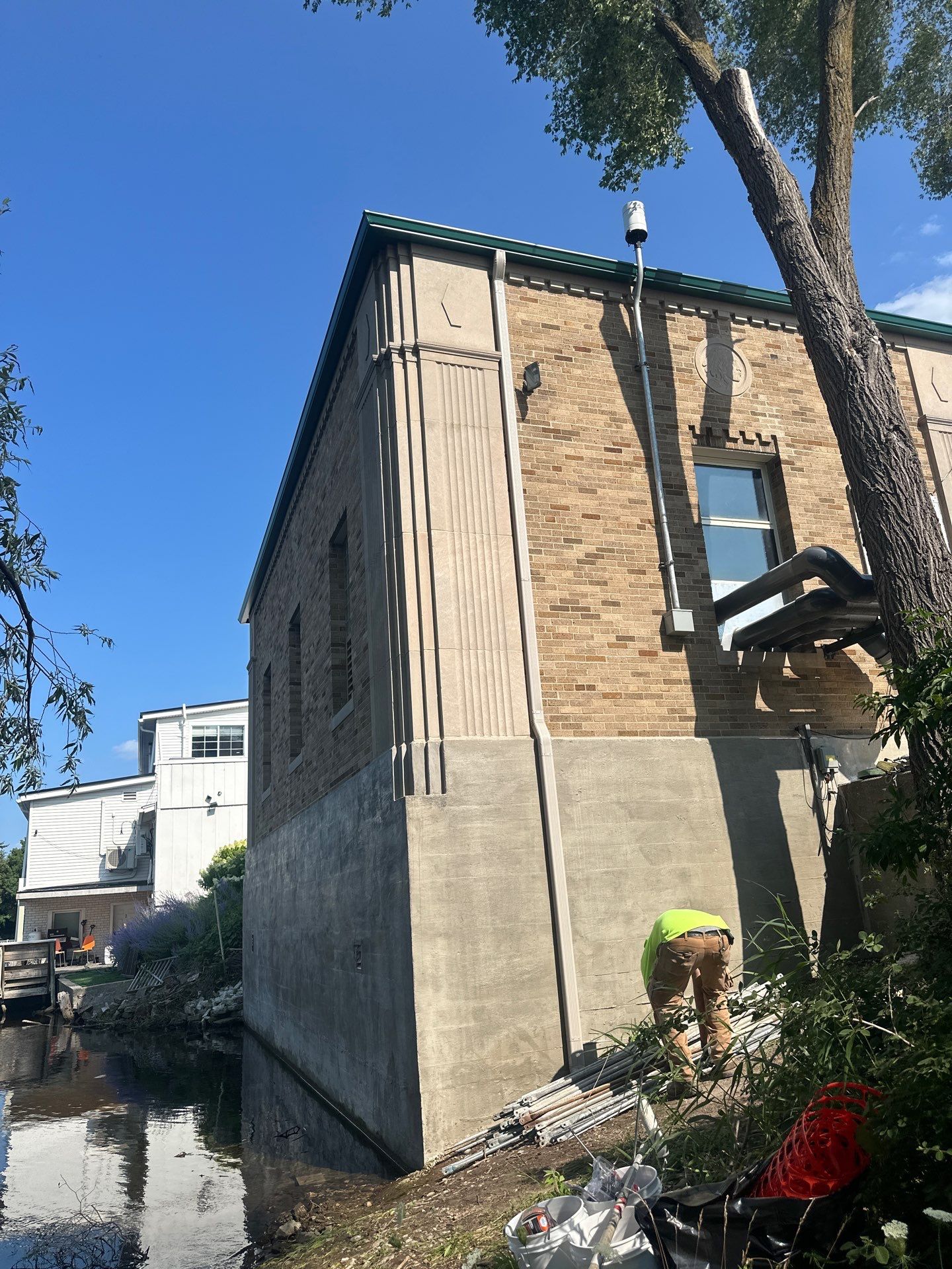 Gutter and Gutter Screen Installation for Traverse City Masonry Building by Rainbow Seamless Systems