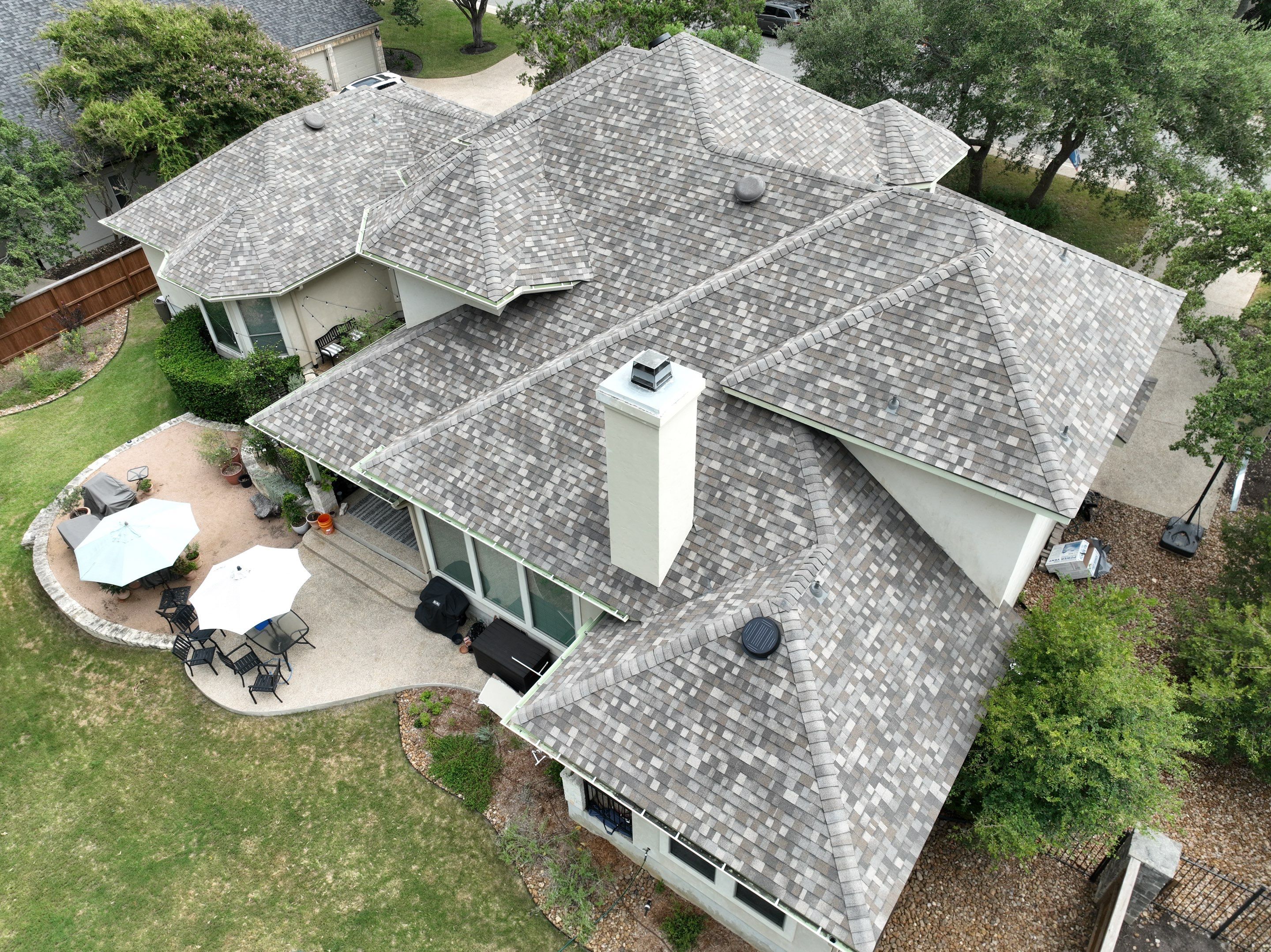 Residential Roof Replacement using 30 Year Laminate Shingles with High Profile Ridge by Premier Roofing and Contracting