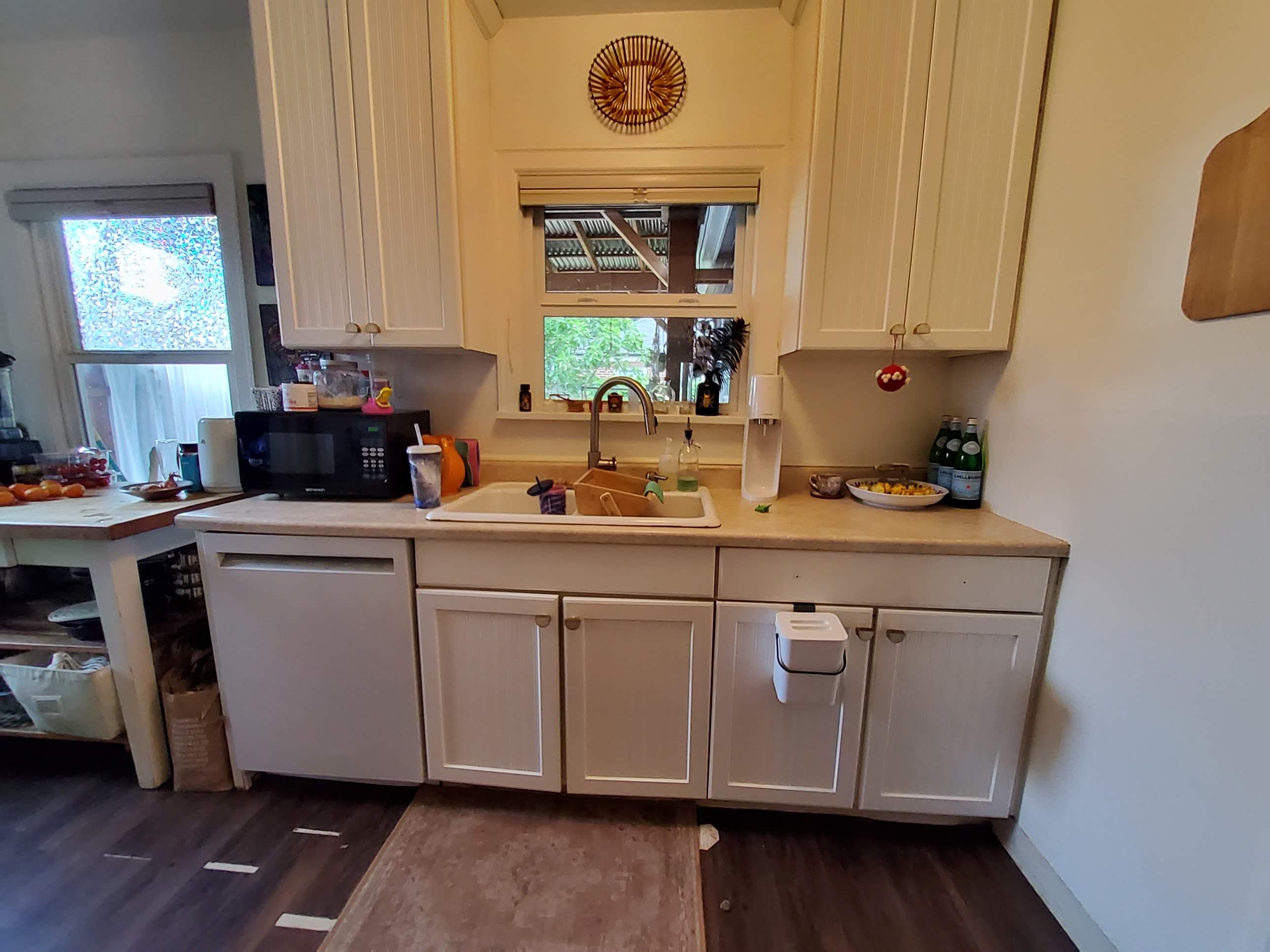 Complete Kitchen Remodeling Featuring Terracotta Tile and Wood Cabinetry by American Made Construction 