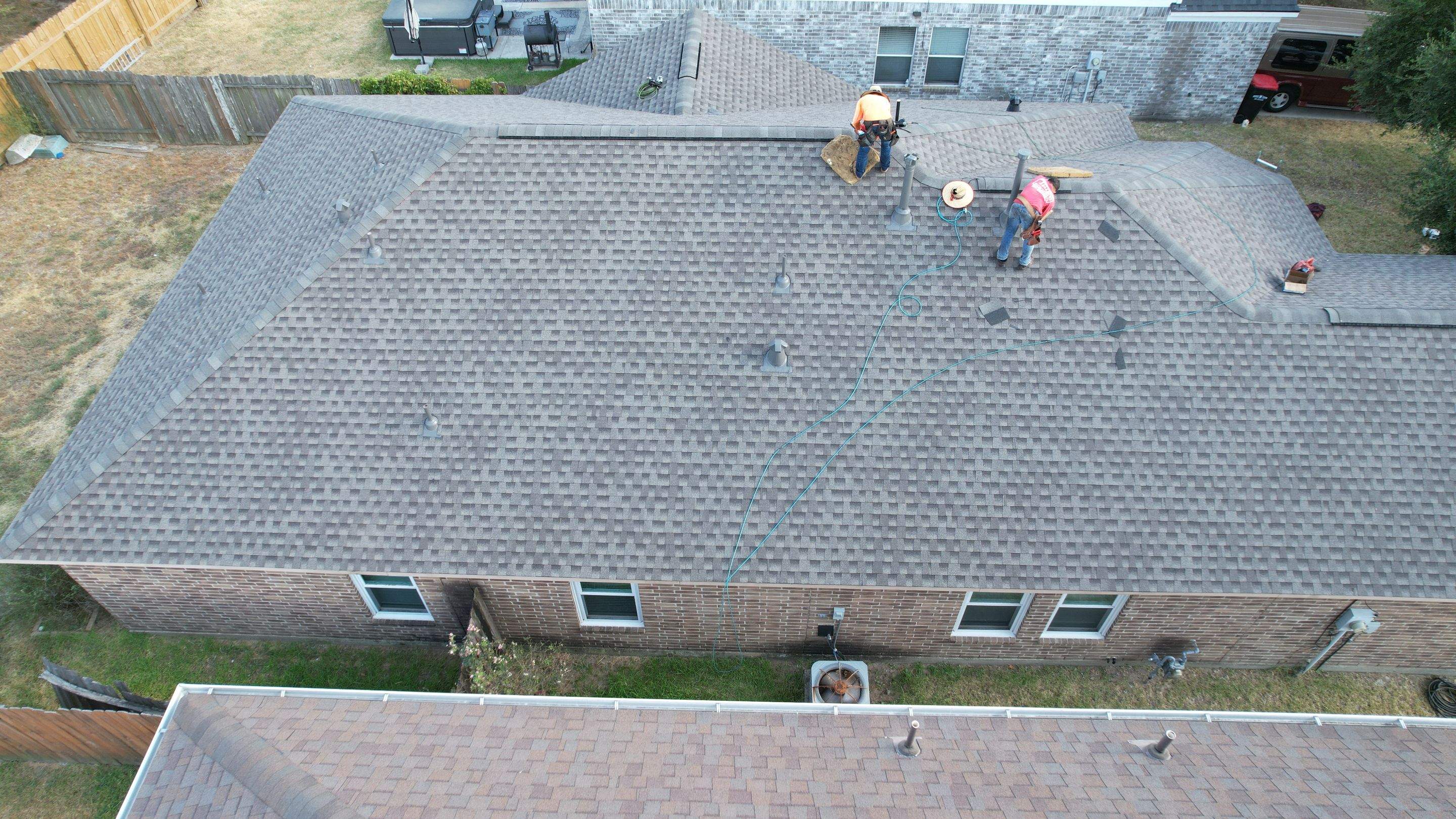 Full Roof Replacement on Two-Story Brick Home — Spring, TX by PL Roofing & SB Roofing, LLC.