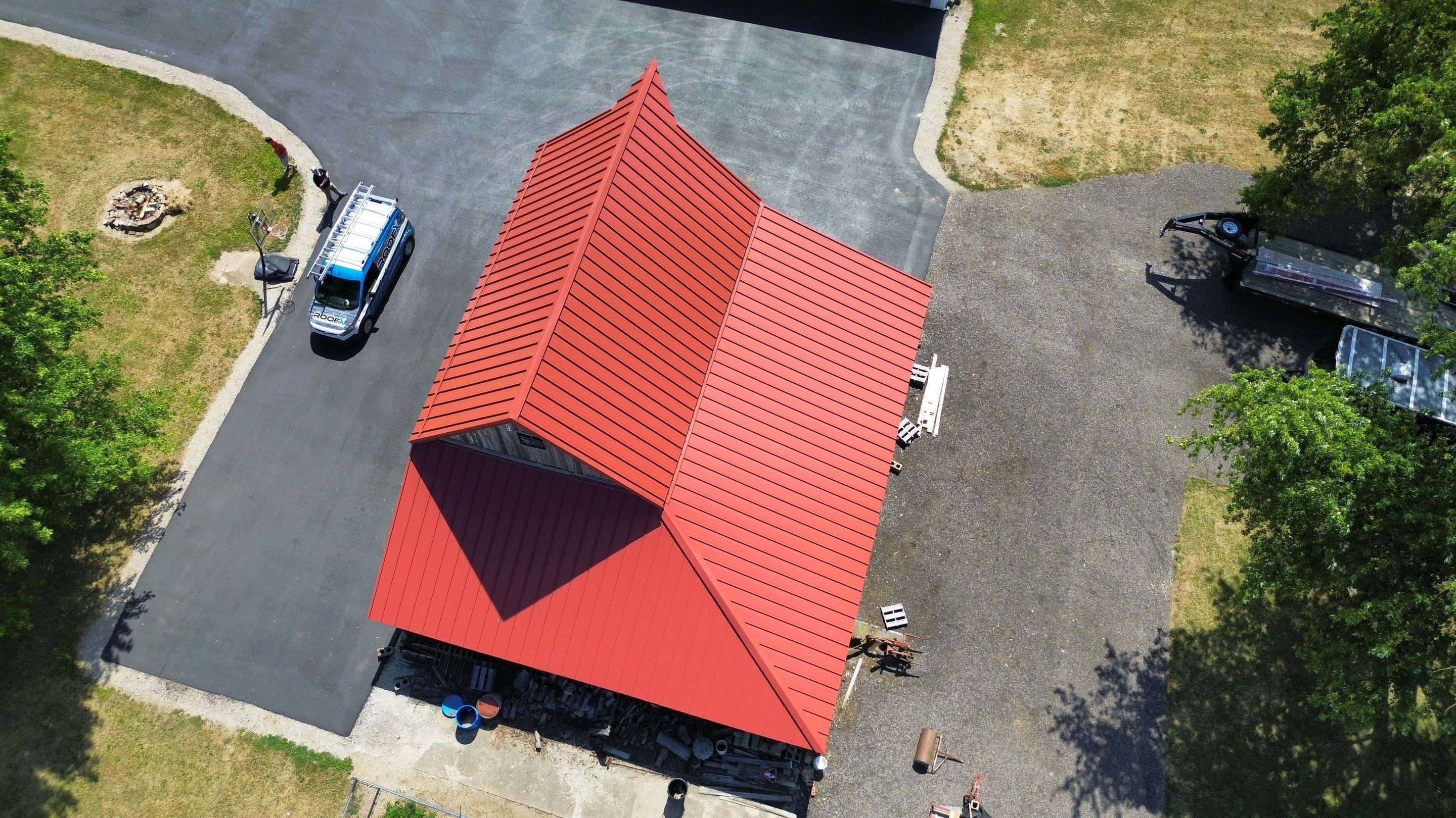 Residential Roofing Installation using Standing Seam Metal - Barn Red by RoofX 