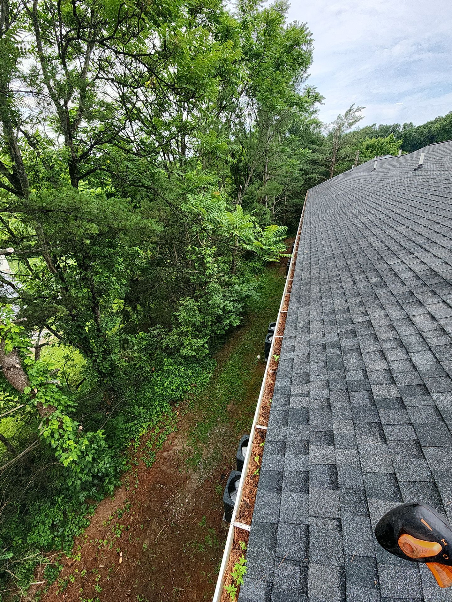 HOA gutter cleaning in Hagerstown, MD,before photo showing full gutters.