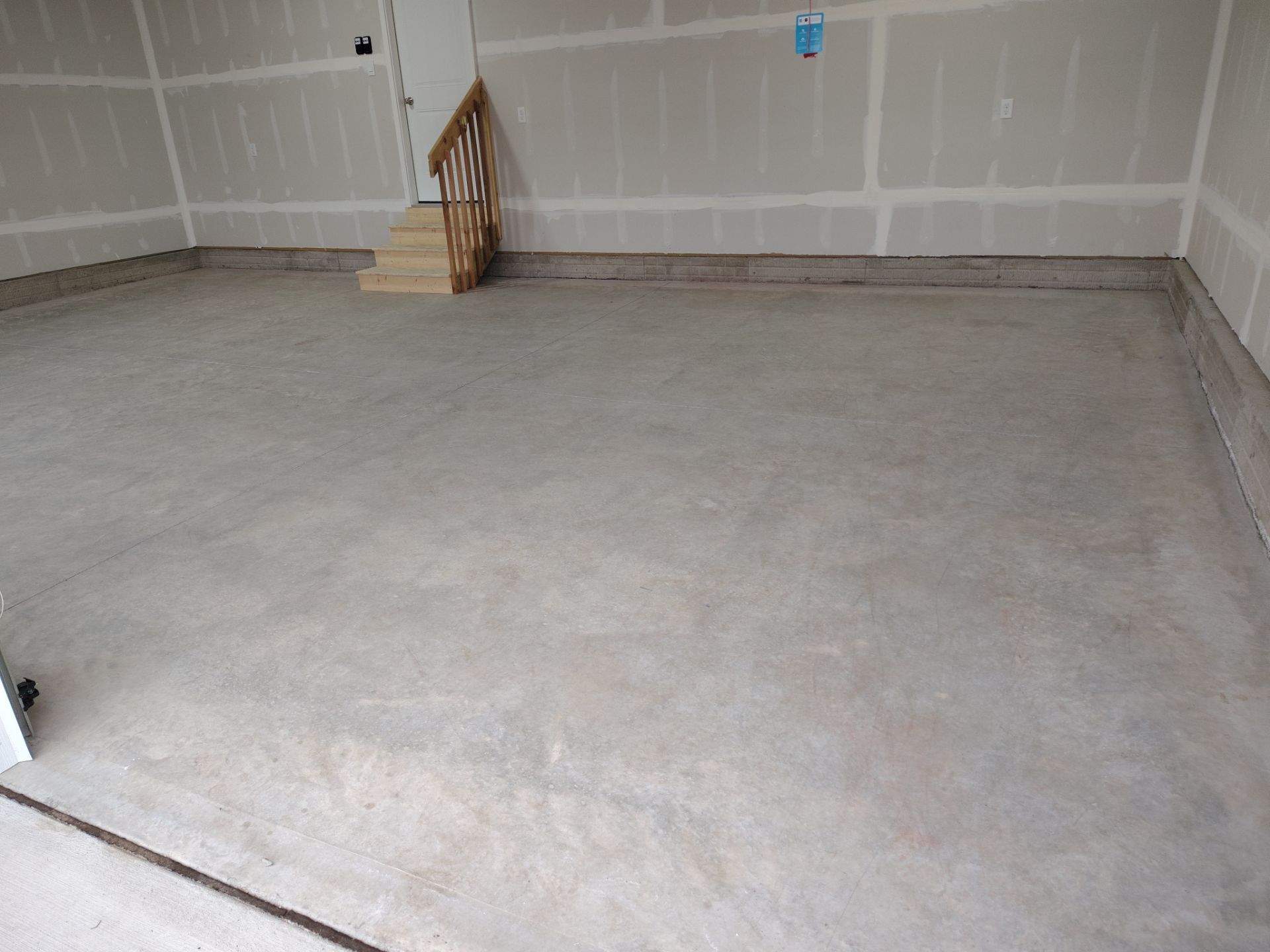 Adel, IA Garage: Complete Keystone Wrap on Floors, Stairs, and Stem Walls by Revival Concrete Coatings