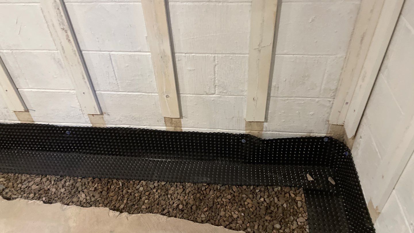 Interior Drain Tile & Buried Discharge in St. Anthony, MN by Waterproofing Northeast