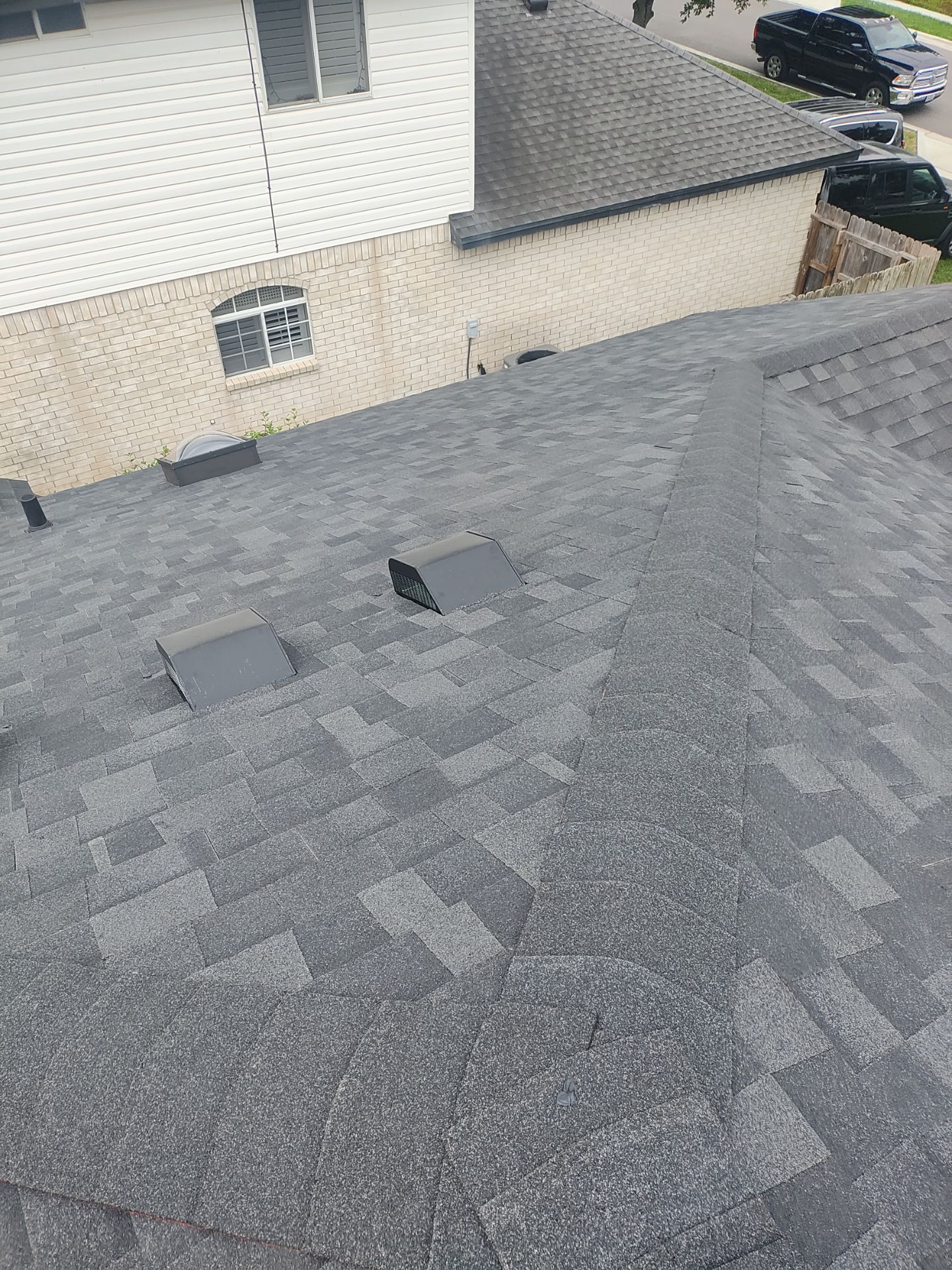 Nothing looks nicer than a little black roof by Bayfront Roofing and Construction