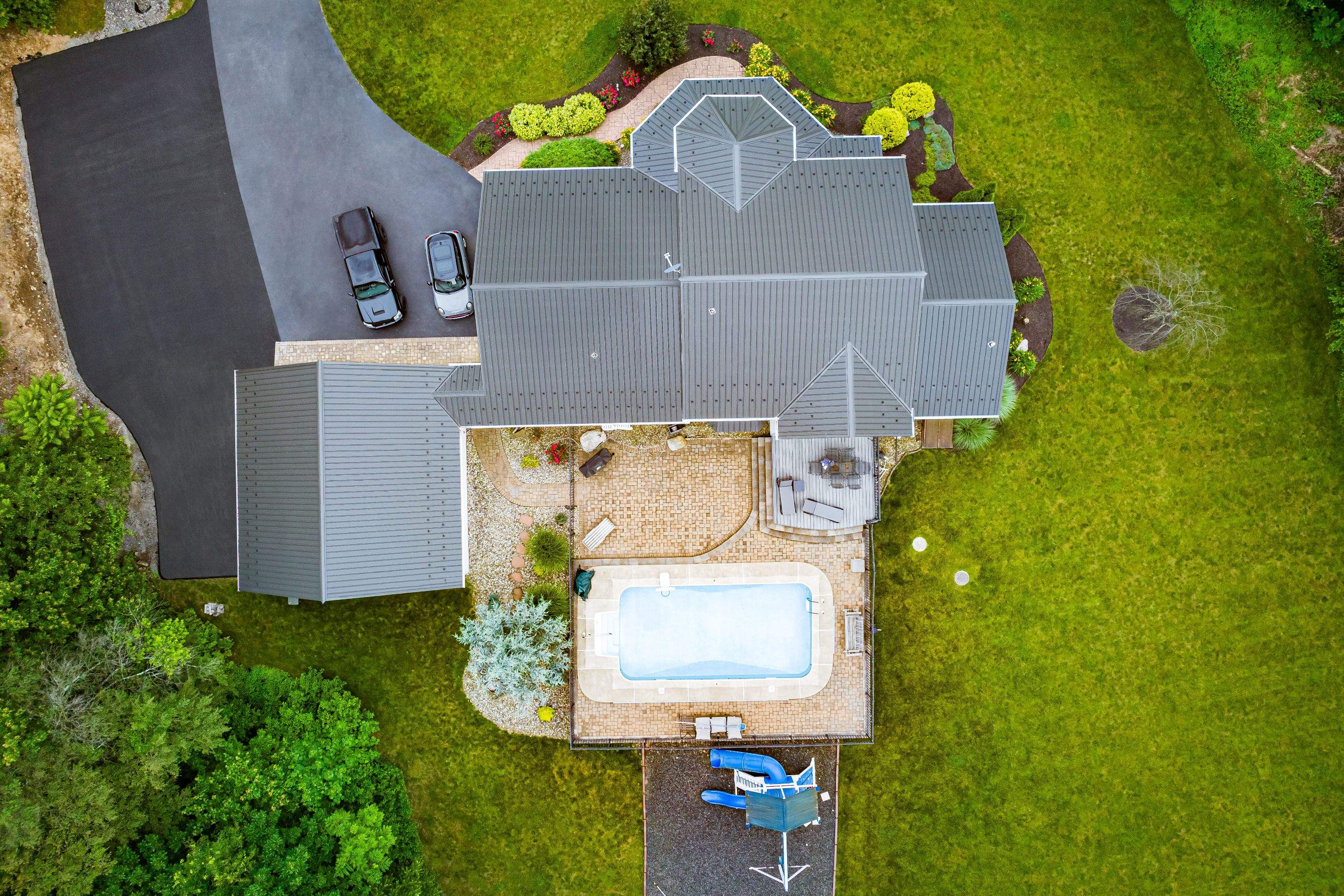 Metal roof install- shadow gray by Esh Builders