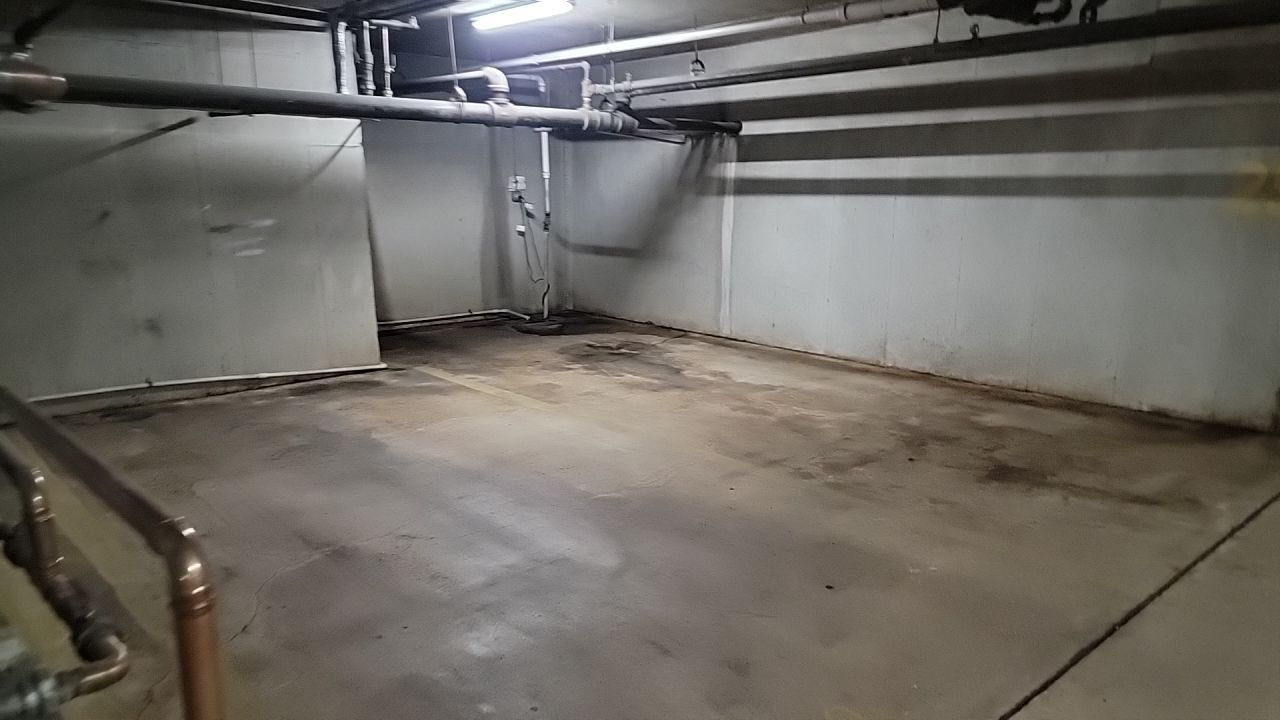 Parking garage using Hot water by Northern Power Washing LLC.